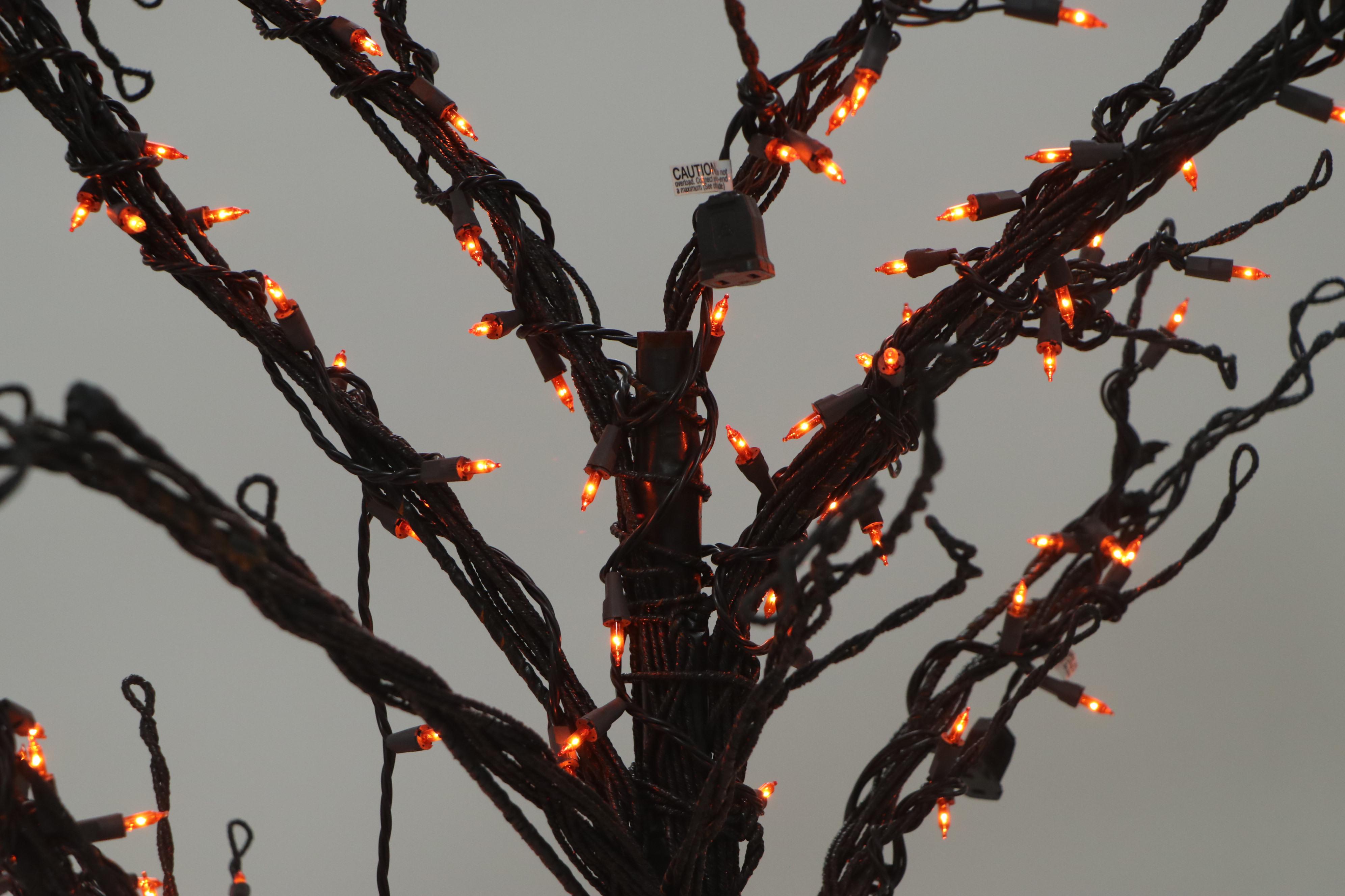 Halloween Décor Including Life-Size Zombie, Large Bat, and Illuminated Tree