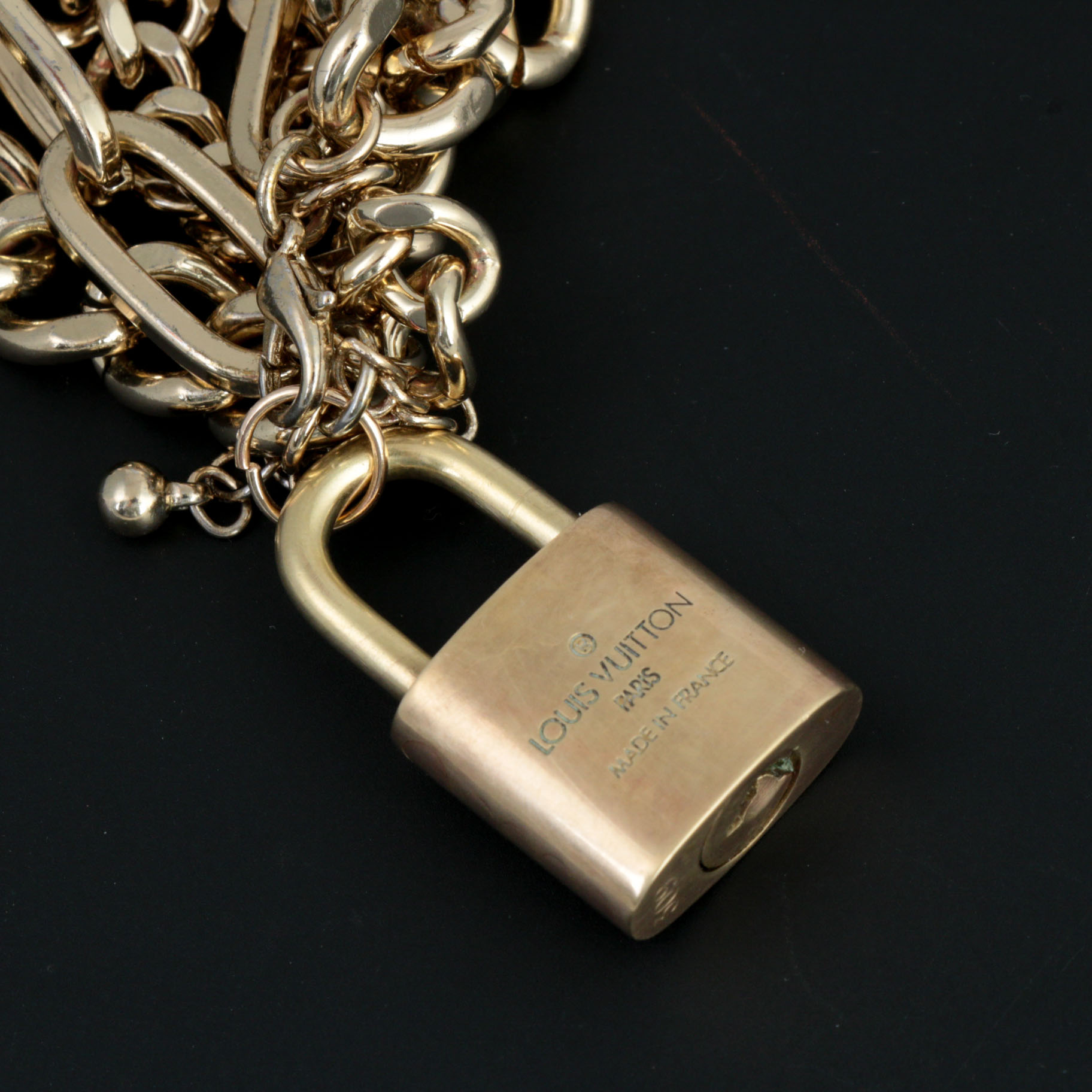 Louis Vuitton Brass Lock on Gold Tone Multistrand Bracelet