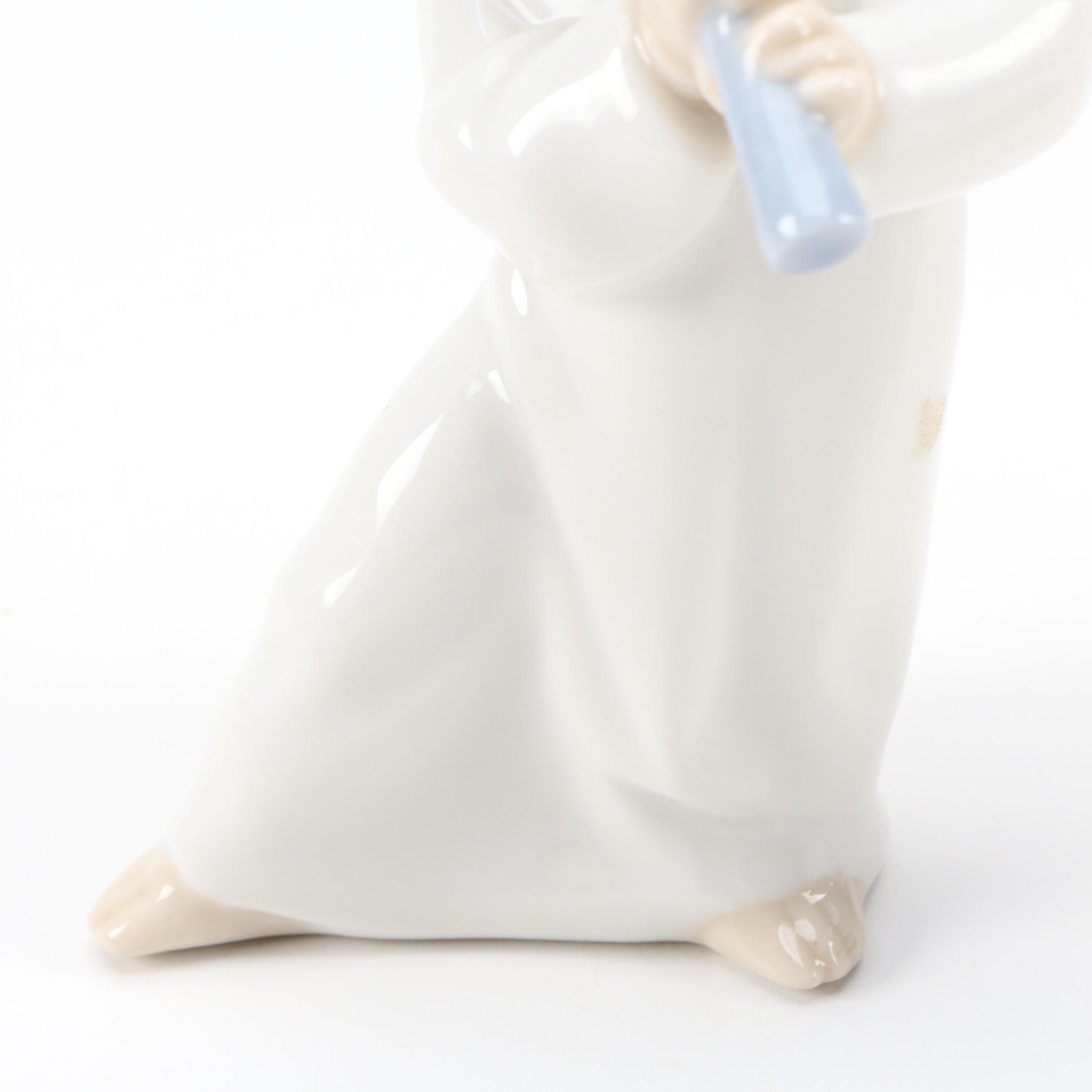 Lladró "Angel with Flute" and "Angel Laying Down" Porcelain Figurines