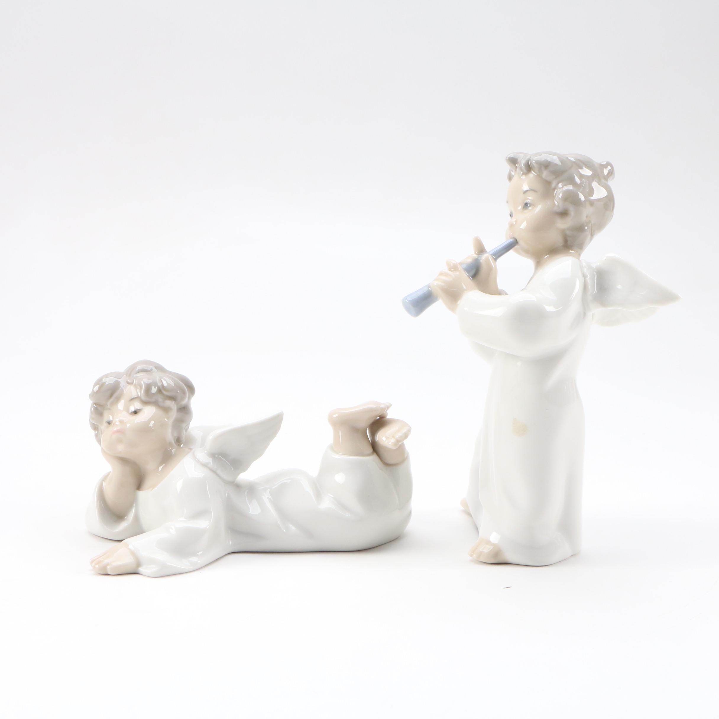 Lladró "Angel with Flute" and "Angel Laying Down" Porcelain Figurines