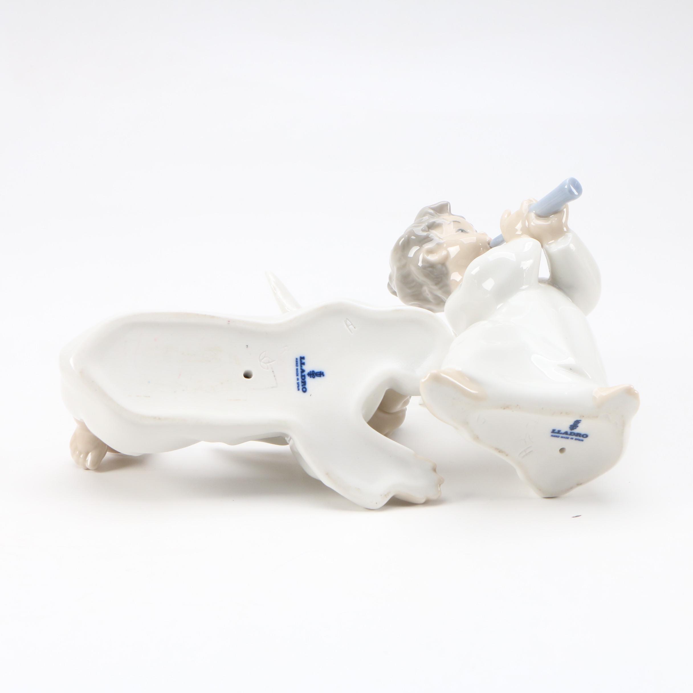 Lladró "Angel with Flute" and "Angel Laying Down" Porcelain Figurines