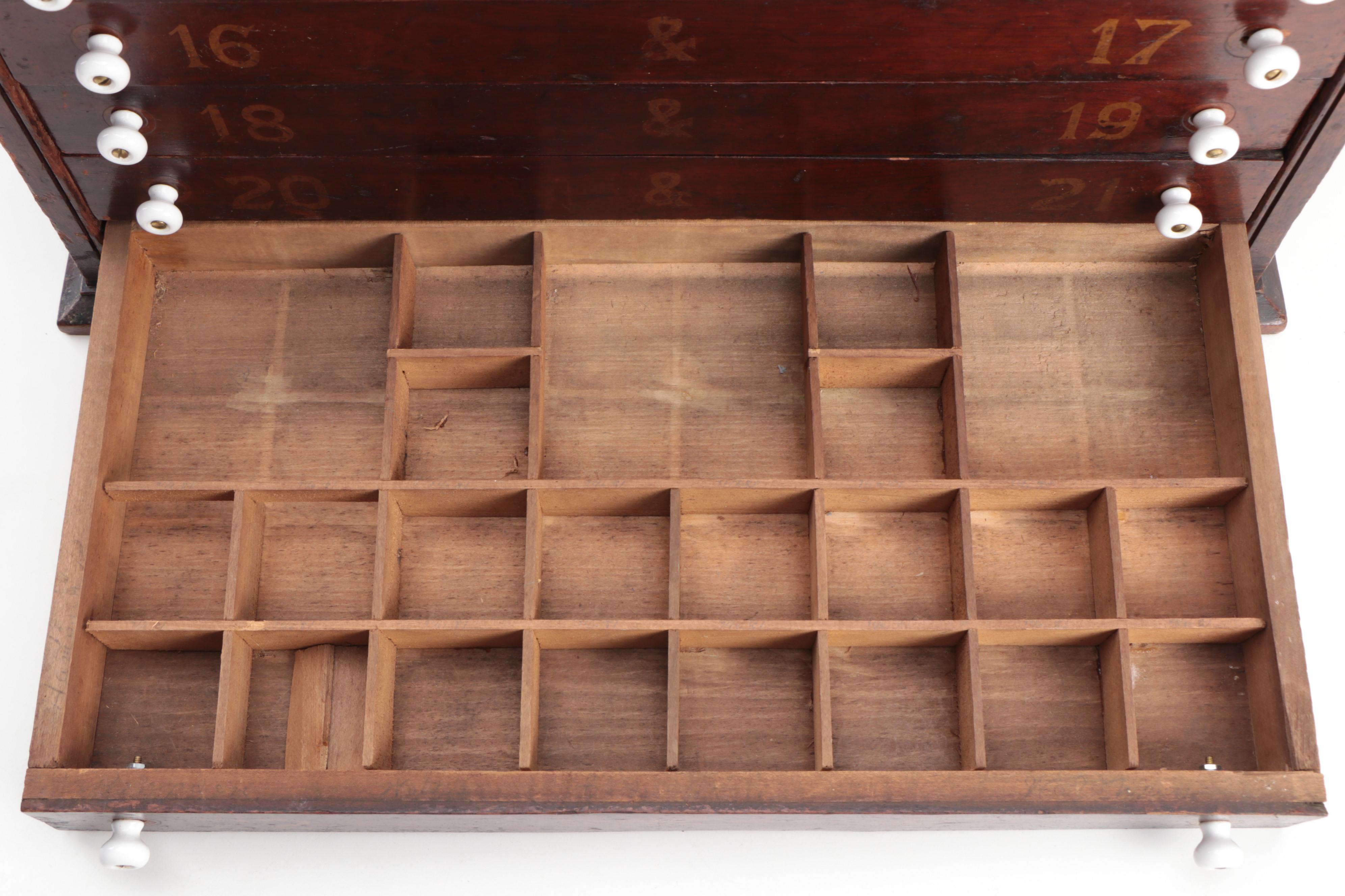 "GENEVA GLASSES" Gilt-Stenciled Walnut Six-Drawer Cabinet, circa 1900