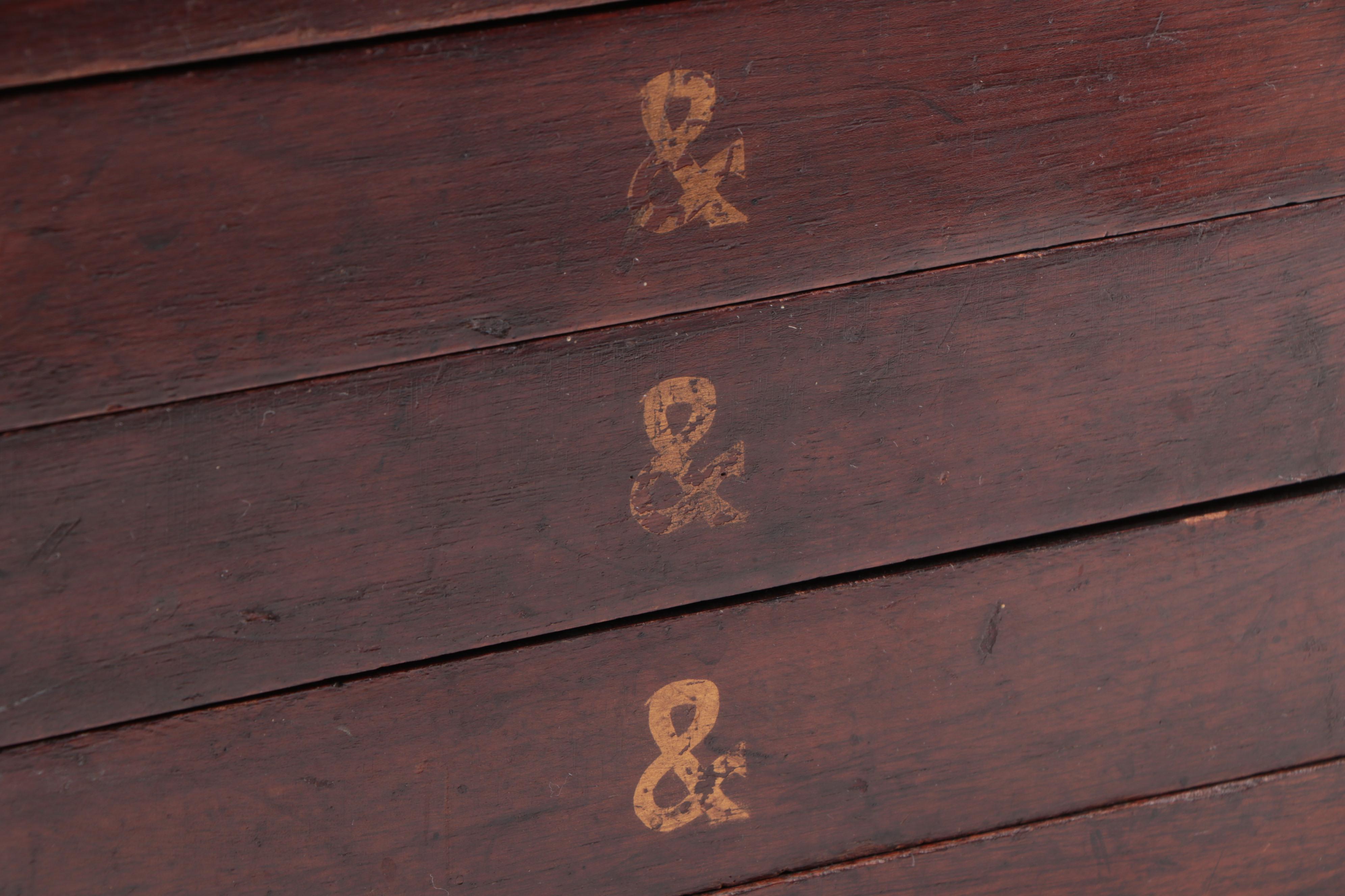 "GENEVA GLASSES" Gilt-Stenciled Walnut Six-Drawer Cabinet, circa 1900