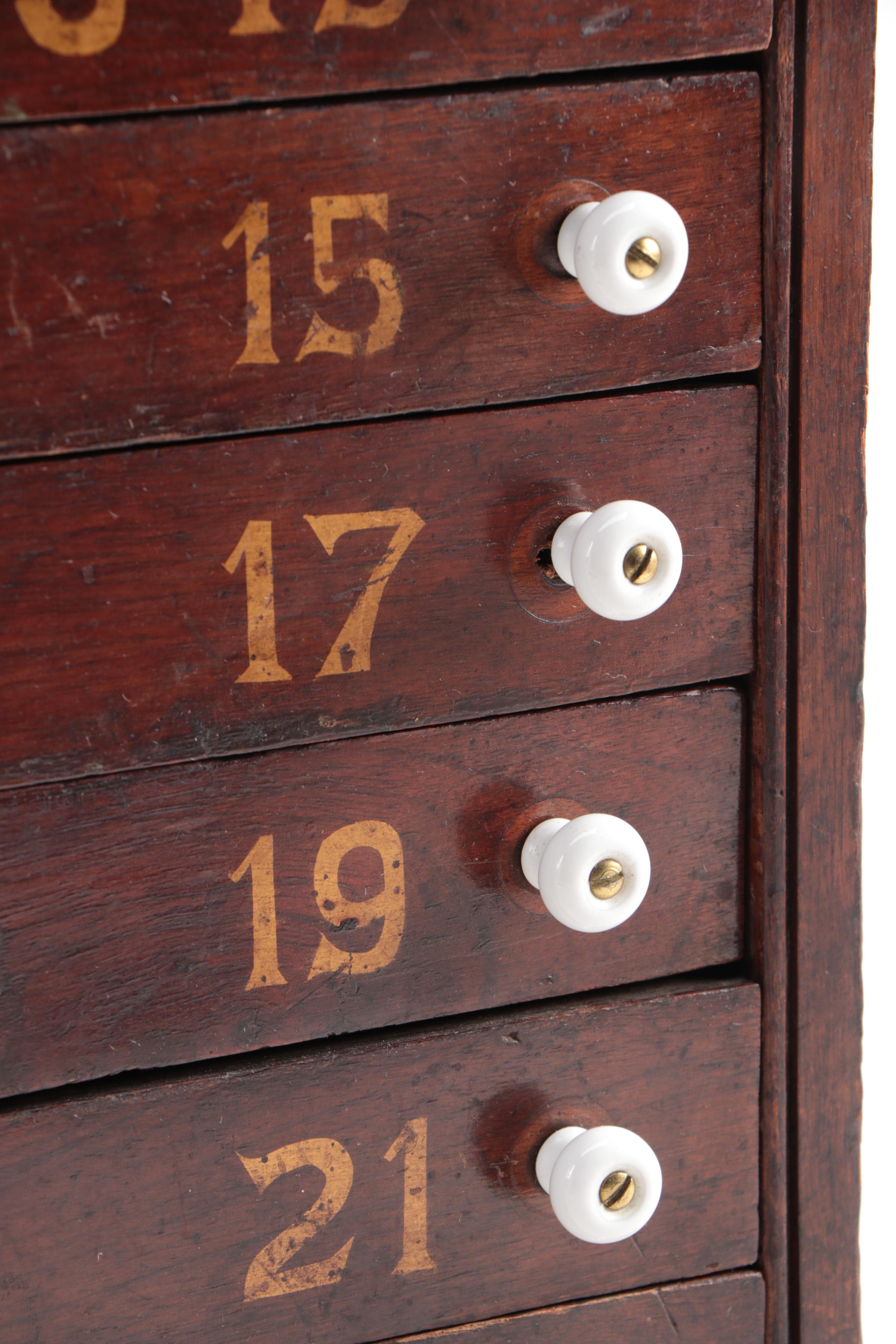 "GENEVA GLASSES" Gilt-Stenciled Walnut Six-Drawer Cabinet, circa 1900