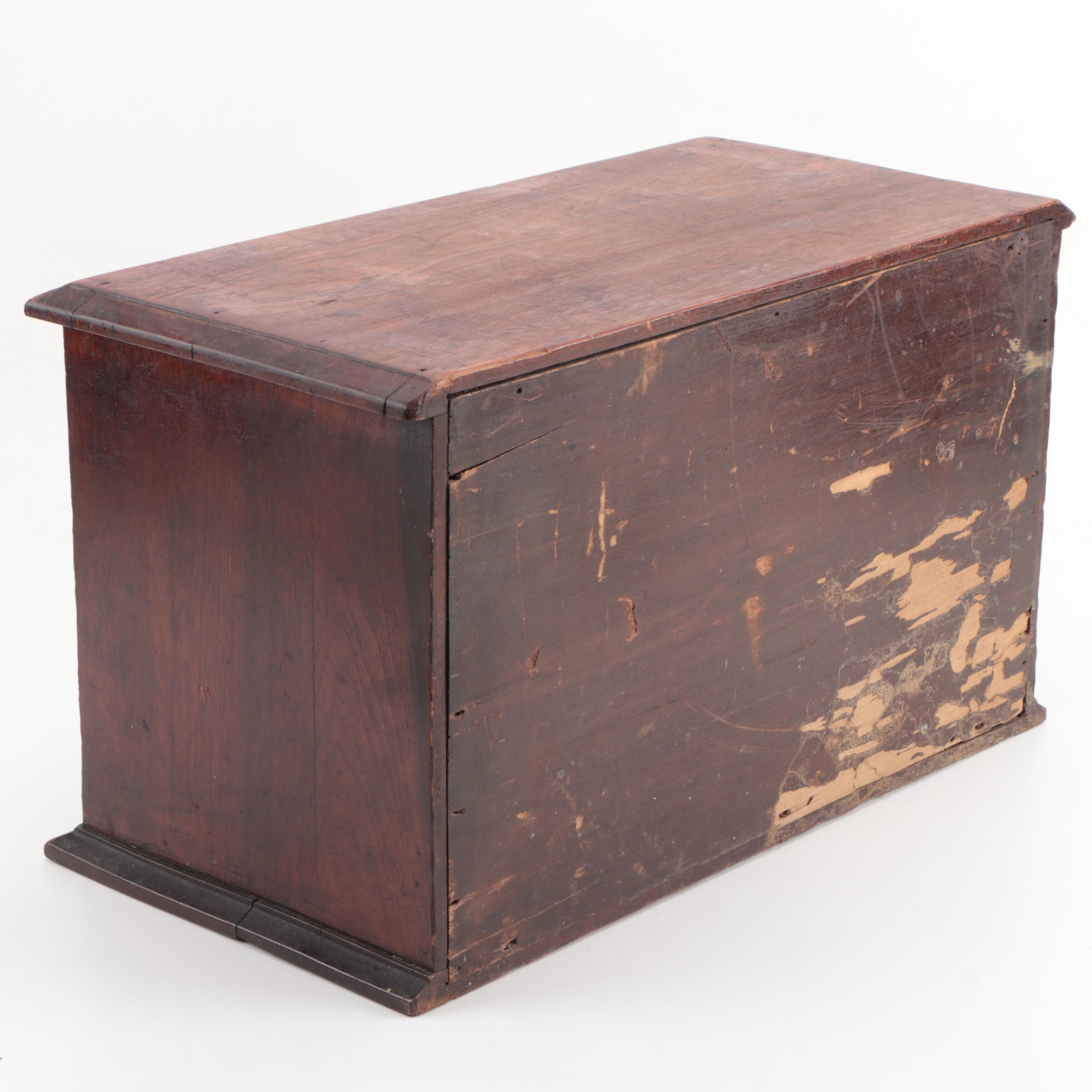 "GENEVA GLASSES" Gilt-Stenciled Walnut Six-Drawer Cabinet, circa 1900