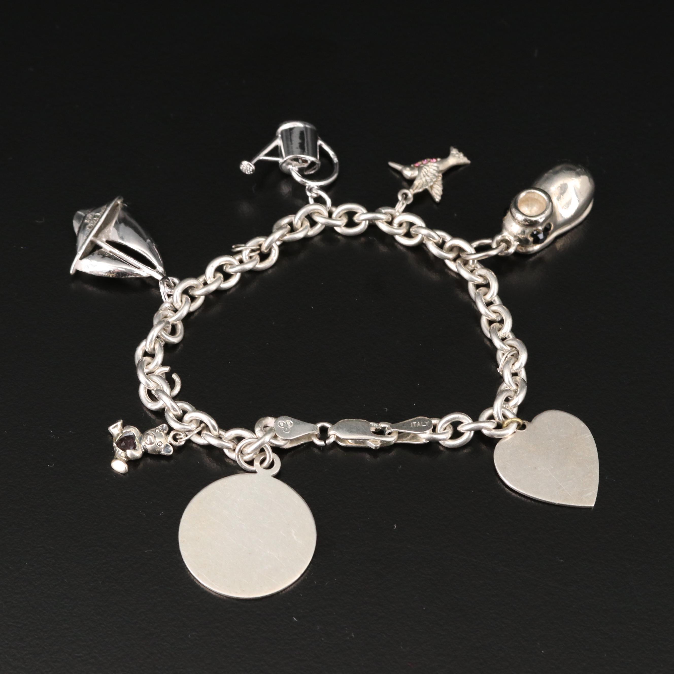 Sterling Charm Bracelet Including Mickey Mouse Shoe and Hummingbird Charms
