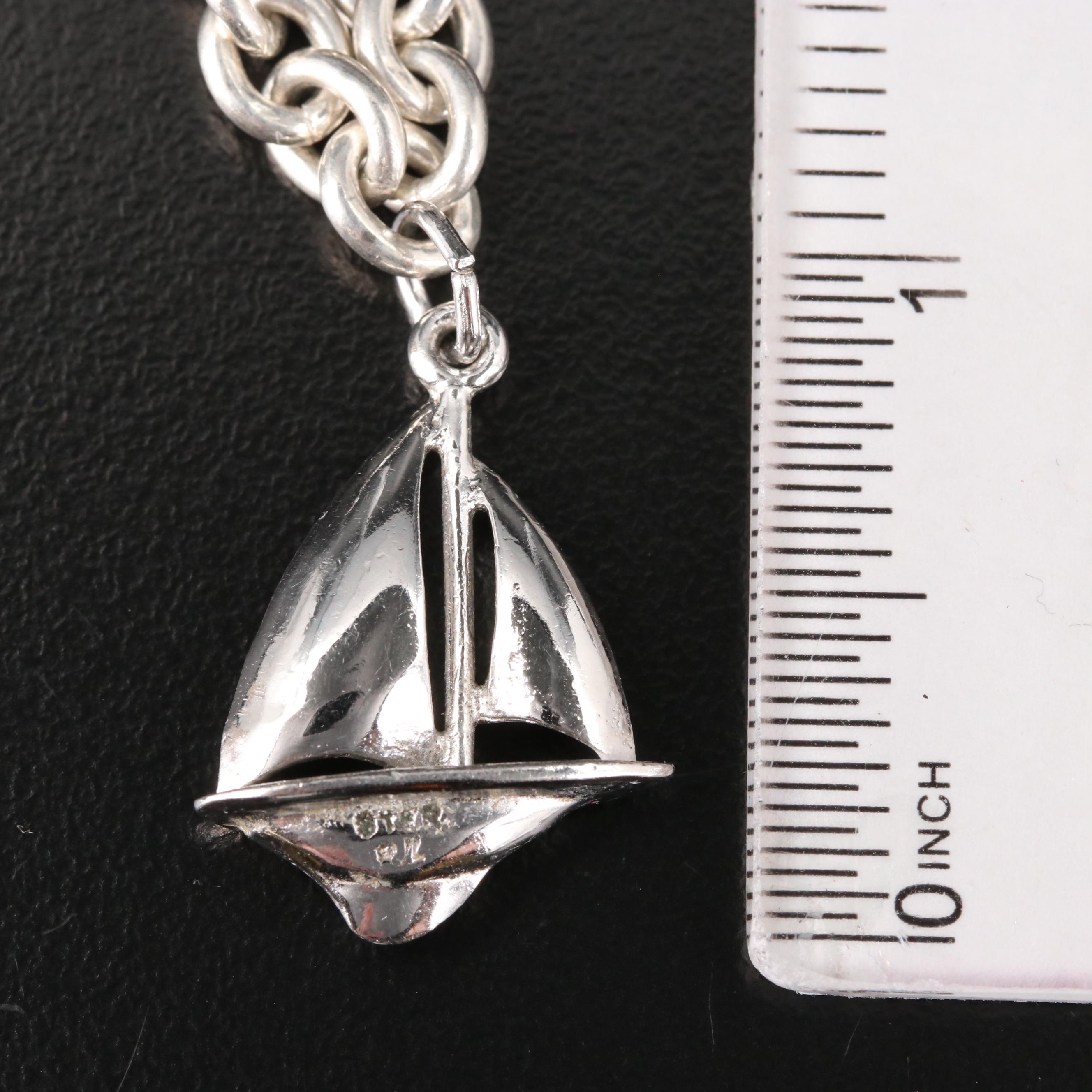 Sterling Charm Bracelet Including Mickey Mouse Shoe and Hummingbird Charms