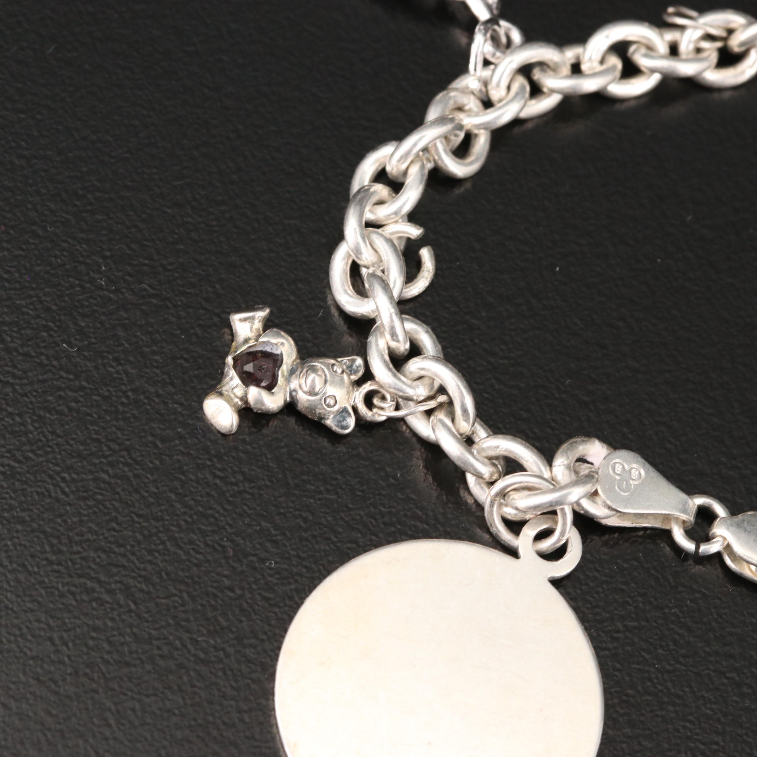 Sterling Charm Bracelet Including Mickey Mouse Shoe and Hummingbird Charms