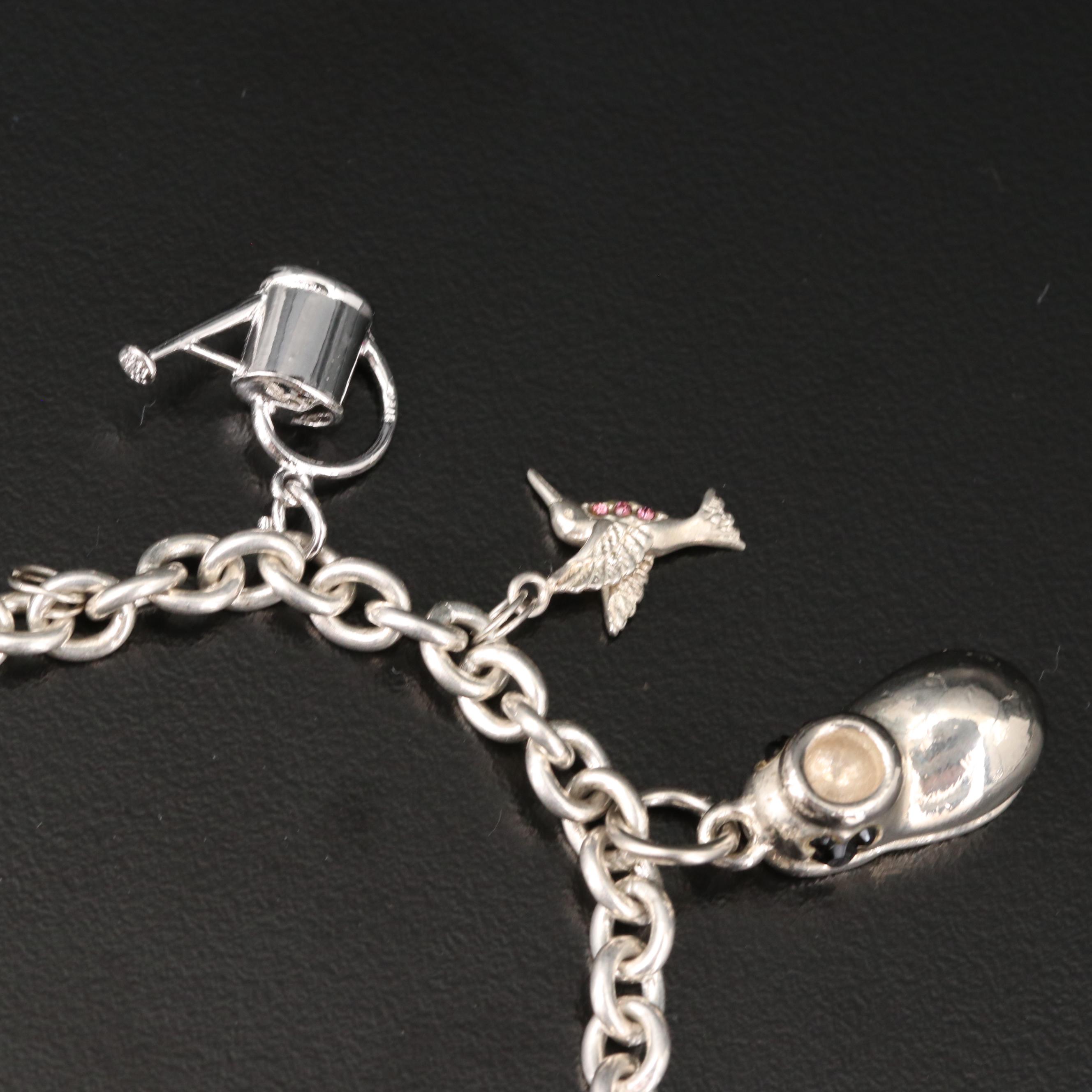 Sterling Charm Bracelet Including Mickey Mouse Shoe and Hummingbird Charms