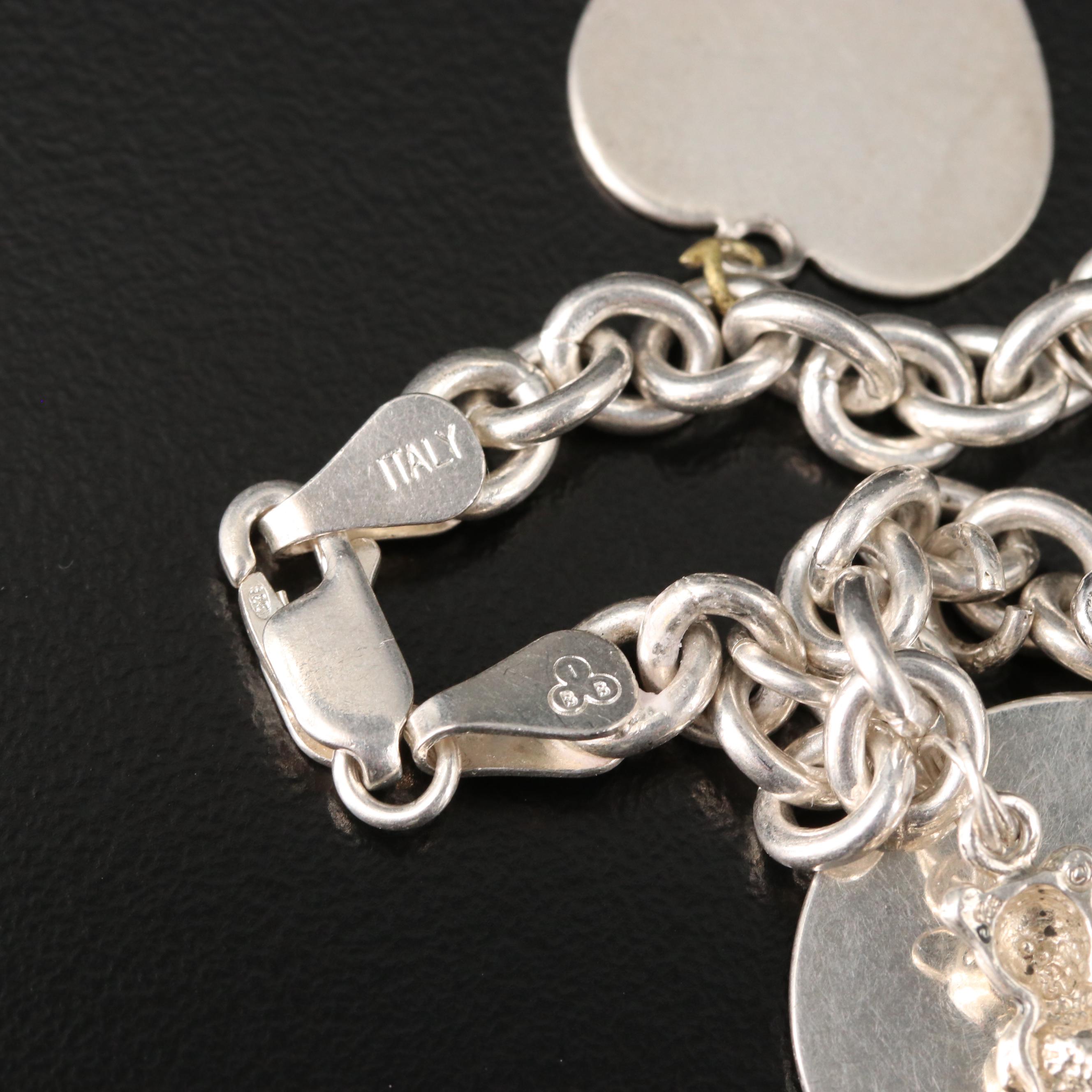 Sterling Charm Bracelet Including Mickey Mouse Shoe and Hummingbird Charms