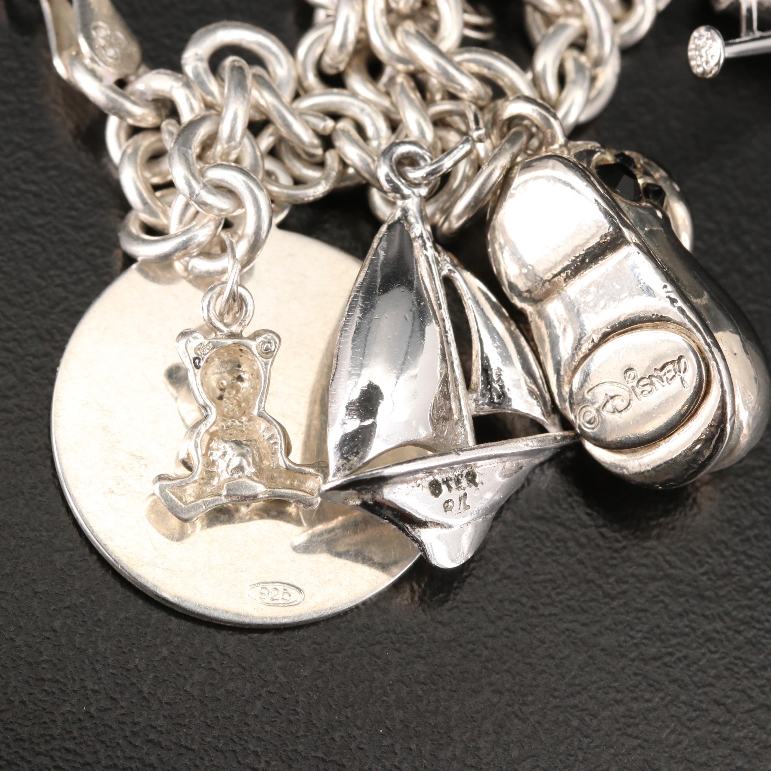 Sterling Charm Bracelet Including Mickey Mouse Shoe and Hummingbird Charms