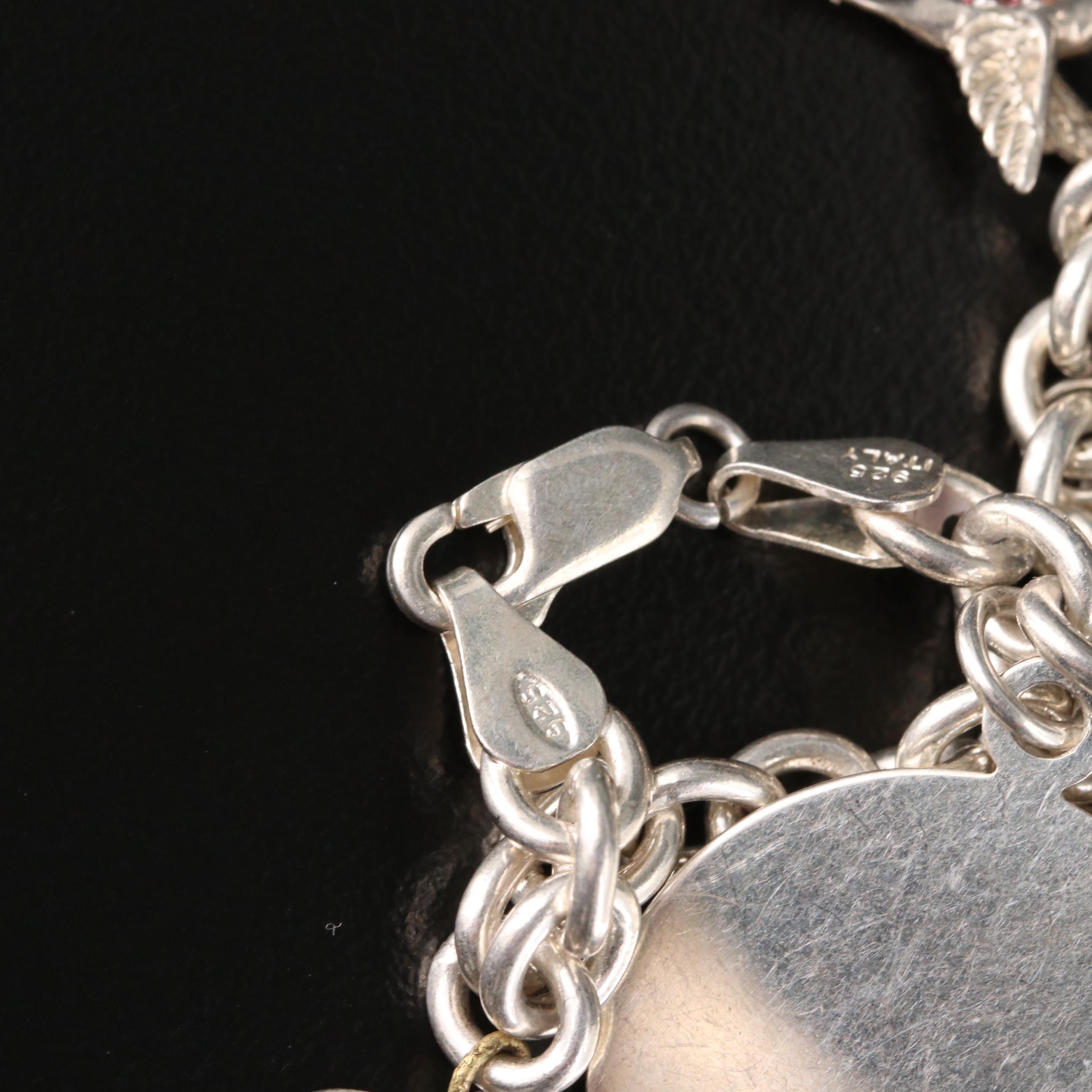 Sterling Charm Bracelet Including Mickey Mouse Shoe and Hummingbird Charms