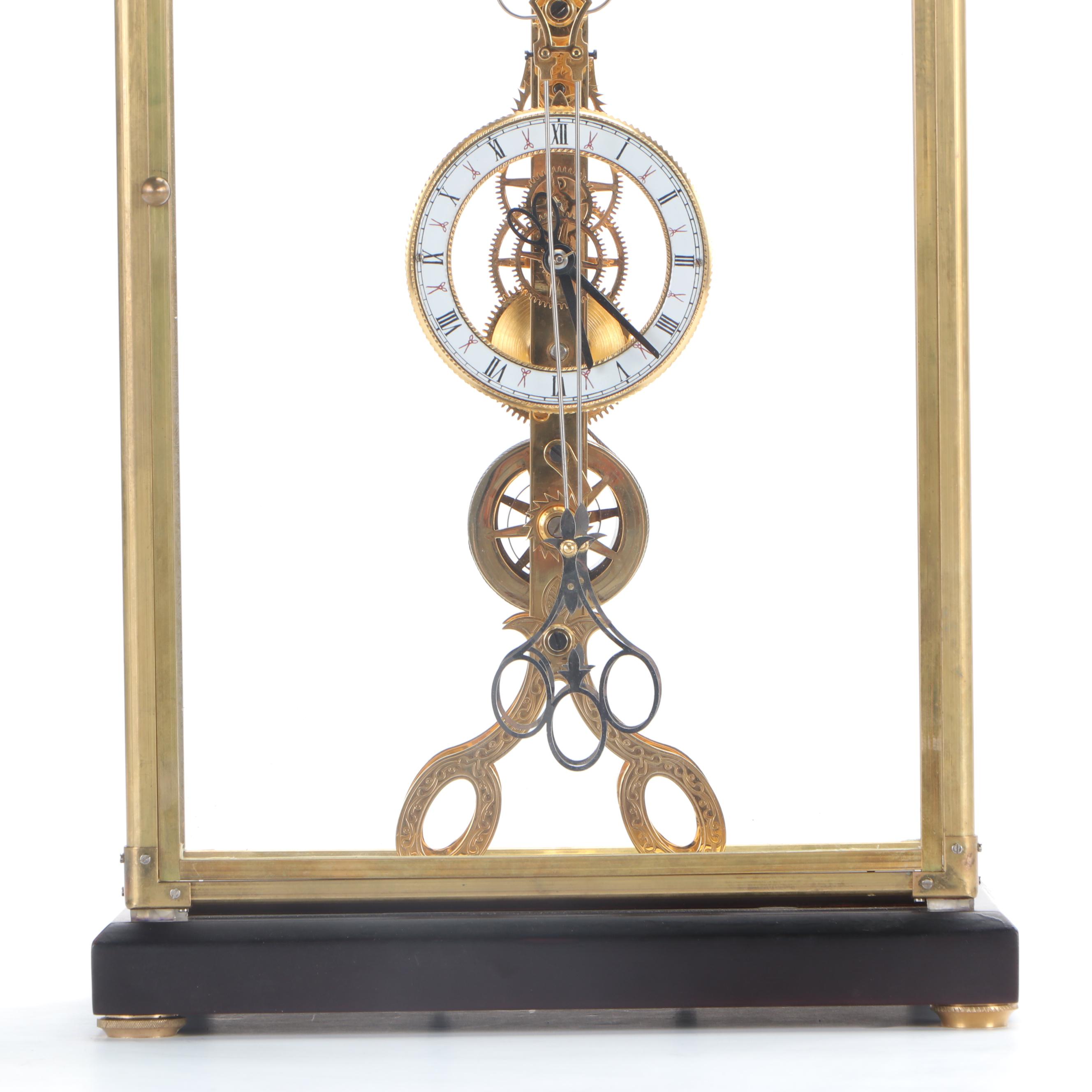 Glass Cased Skeleton Clock with Scissor Pendulum
