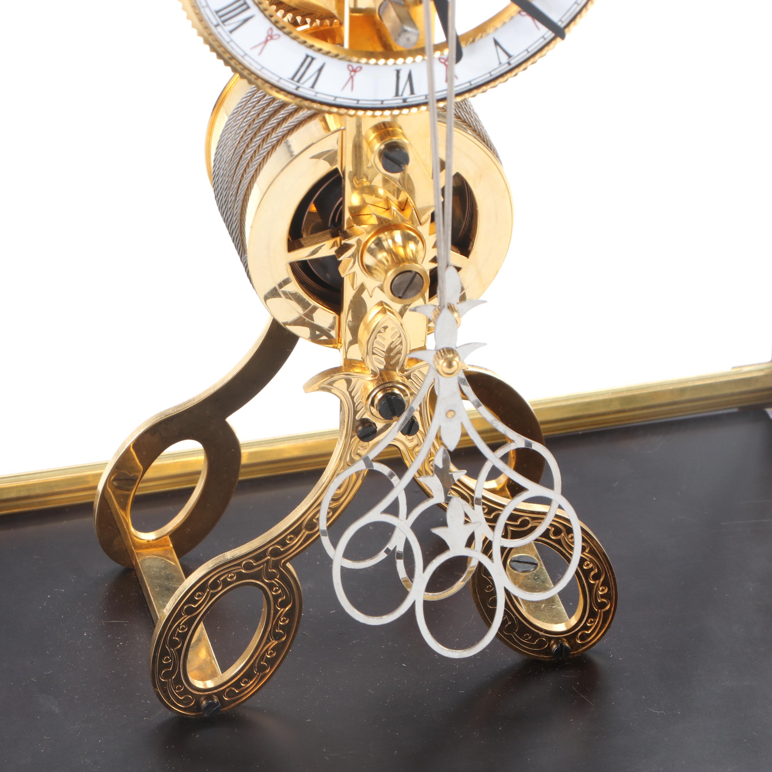 Glass Cased Skeleton Clock with Scissor Pendulum