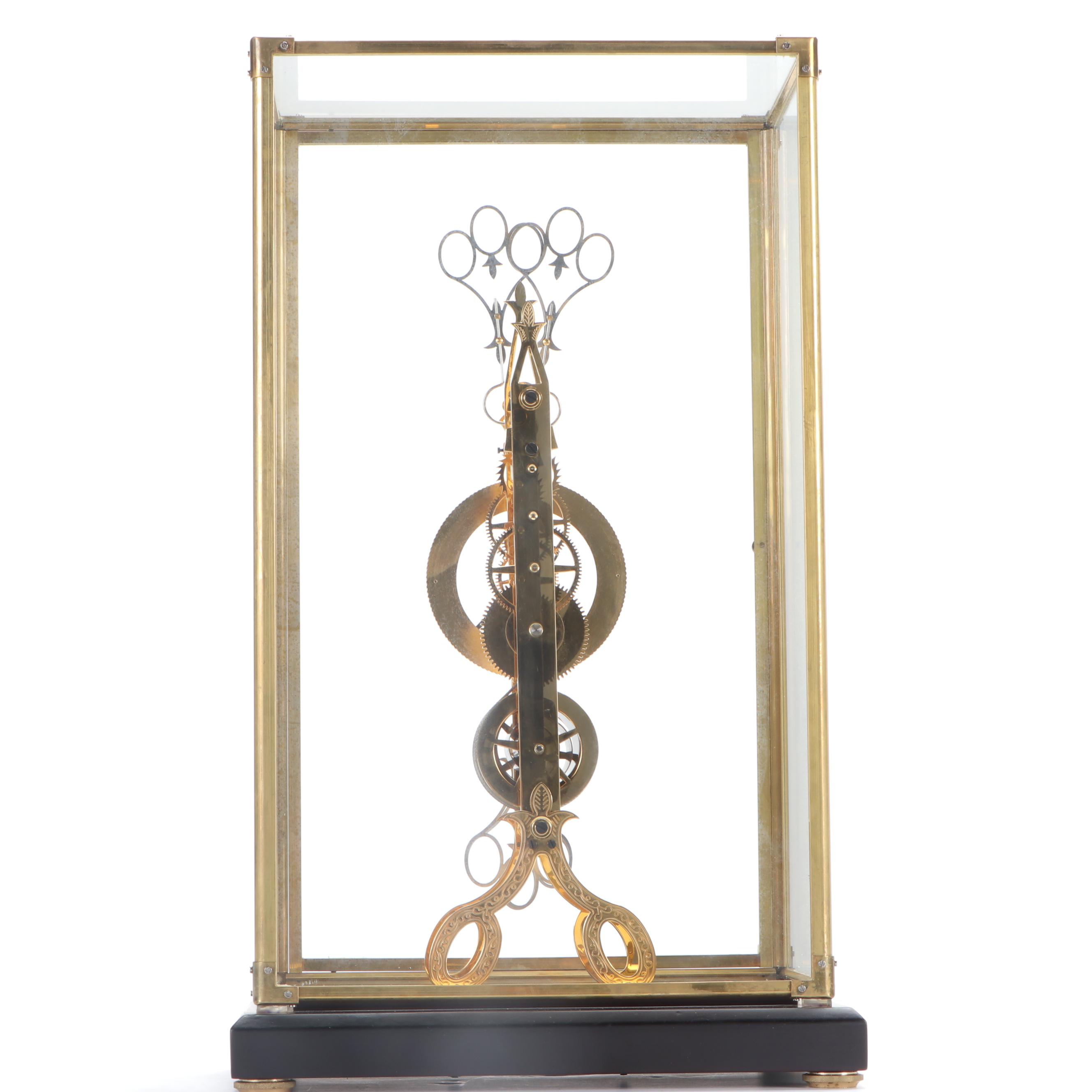Glass Cased Skeleton Clock with Scissor Pendulum