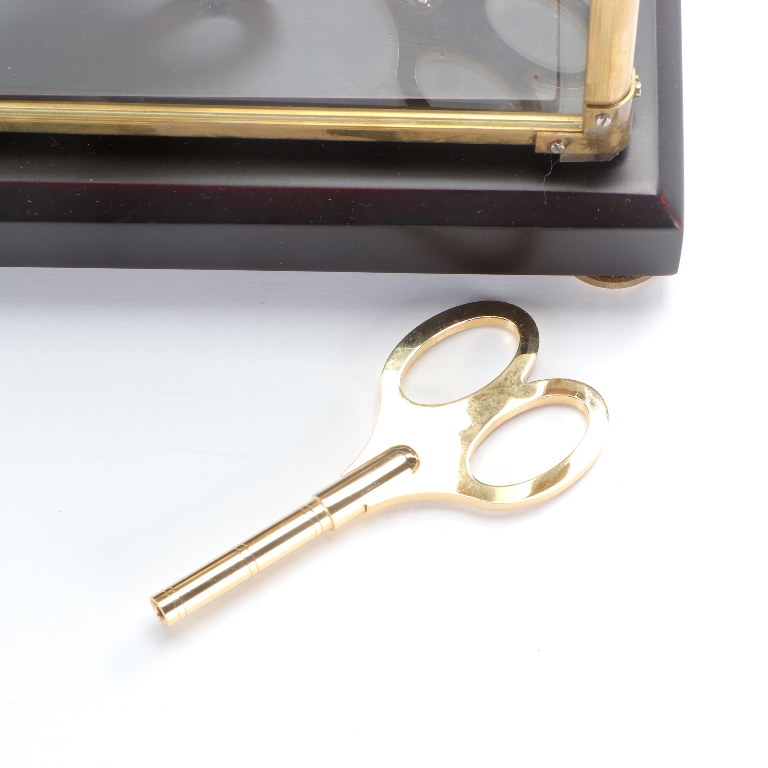 Glass Cased Skeleton Clock with Scissor Pendulum