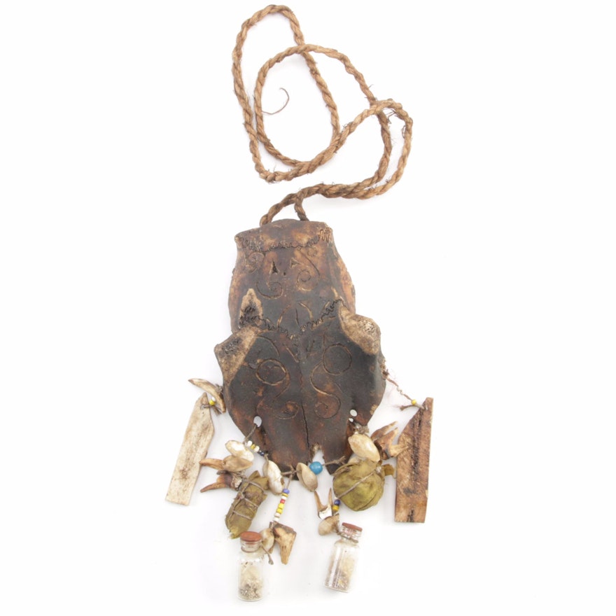 Indonesian Ritual Amulet with Carved Animal Skull, Bone, Shell, and Teeth