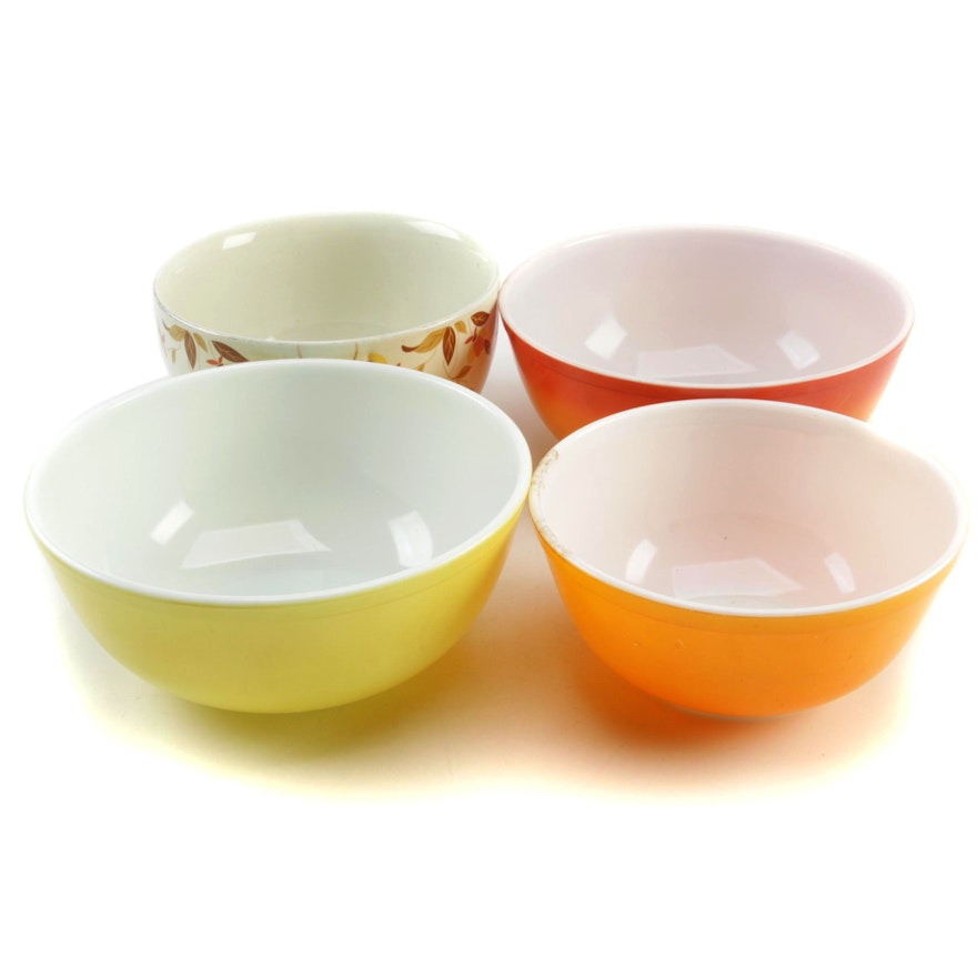 Pyrex Flameglo, Yellow, and Orange Mixing Bowls with Hall "Autumn Leaf" Bowl