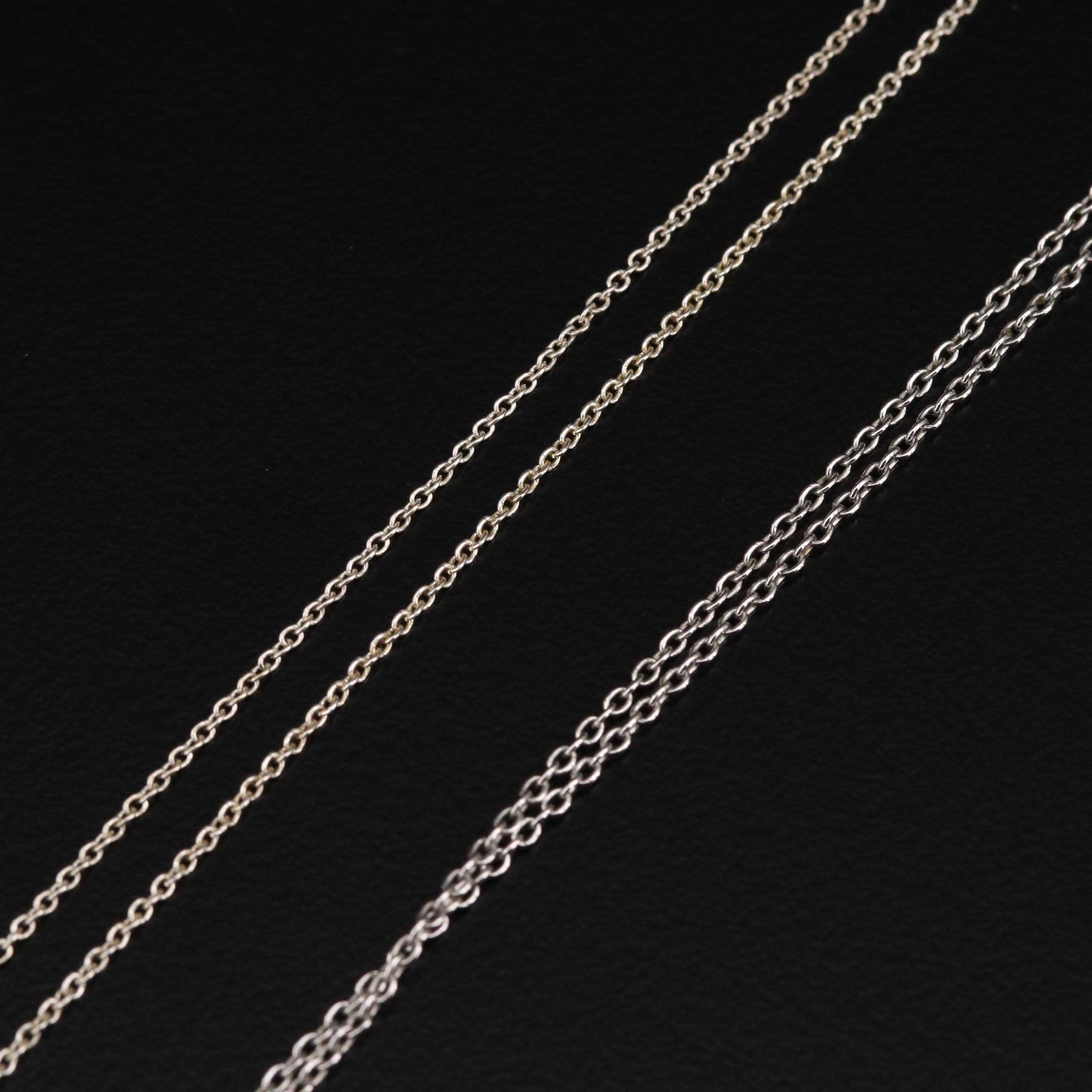 Collection of Sterling Silver Necklaces Including Cross and Dragonfly Pendants