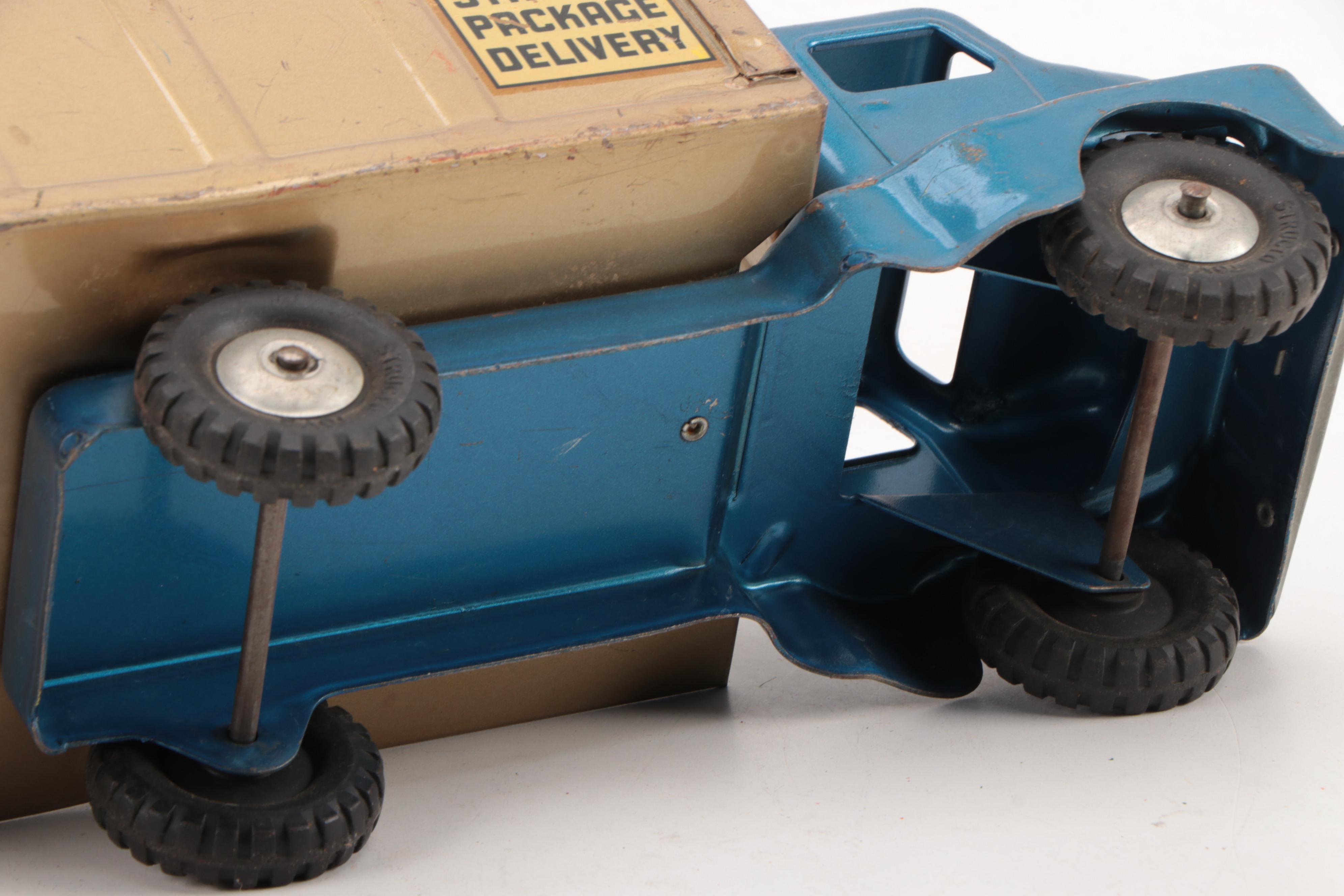 Marx Power Crader and Structo Pressed Steel Package Delivery Truck, Mid-20th C.