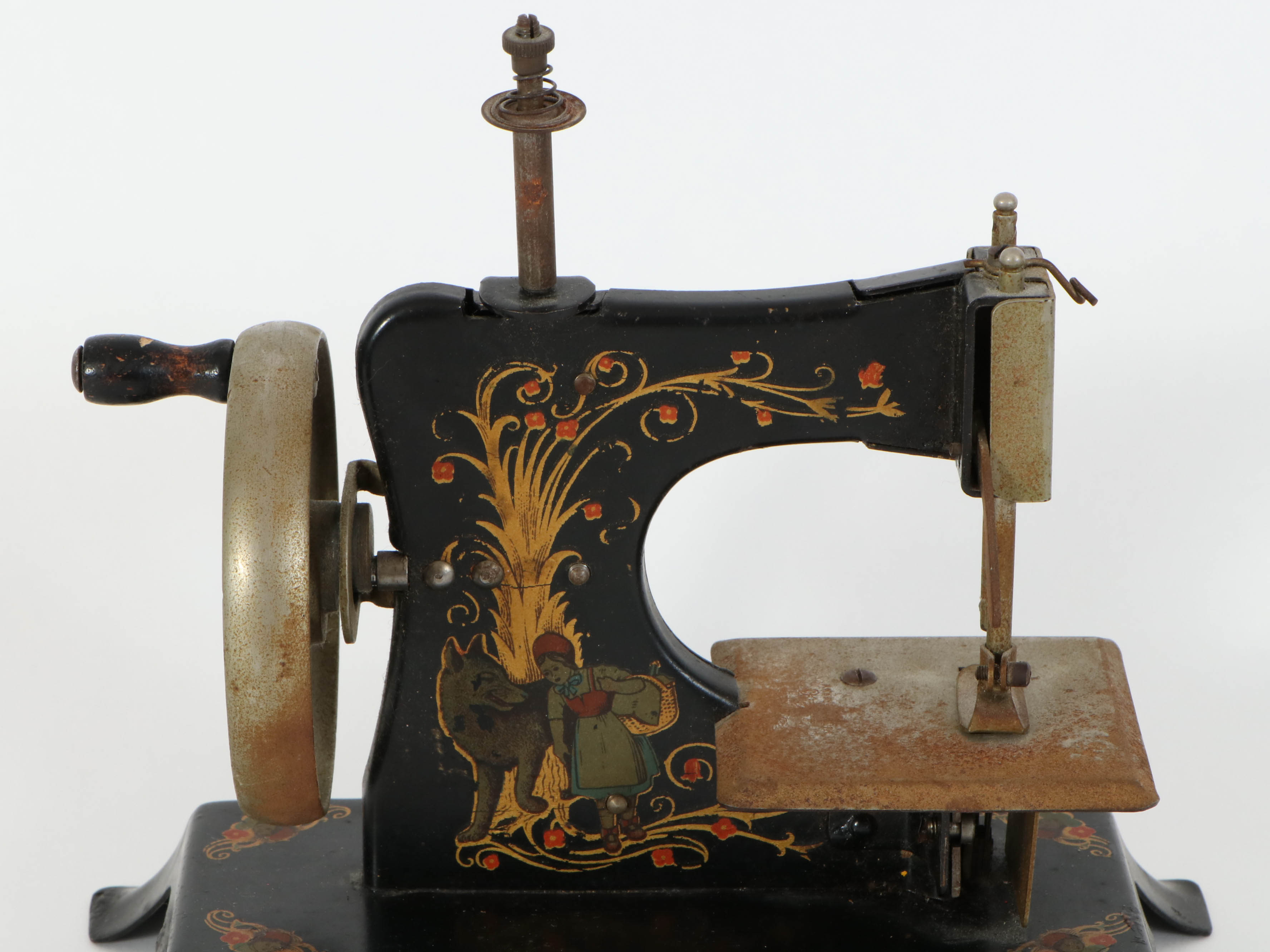Casige German Painted Red Riding Hood Toy Sewing Machine, Mid-20th Century