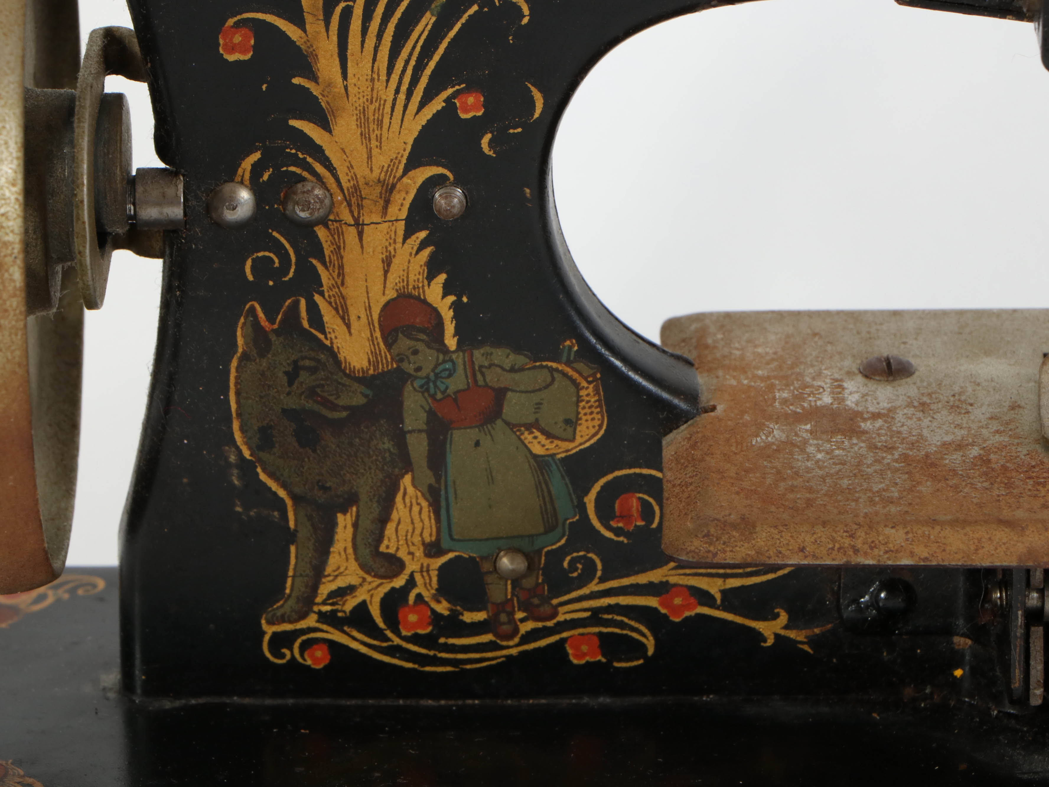 Casige German Painted Red Riding Hood Toy Sewing Machine, Mid-20th Century