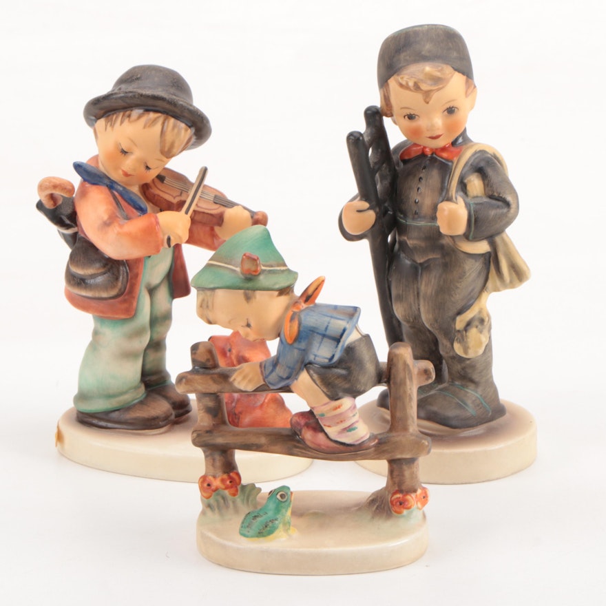 Goebel Hummel "Puppy Love," "Chimney Sweep," and "Retreat to Safety" Figurines