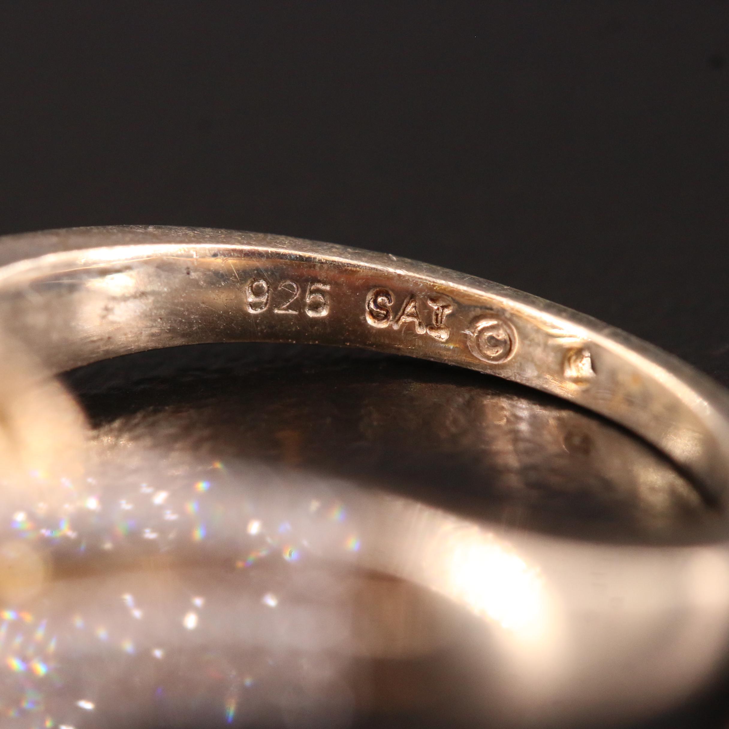 Sterling Silver Swiss BlueTopaz and Diamond Contour Ring