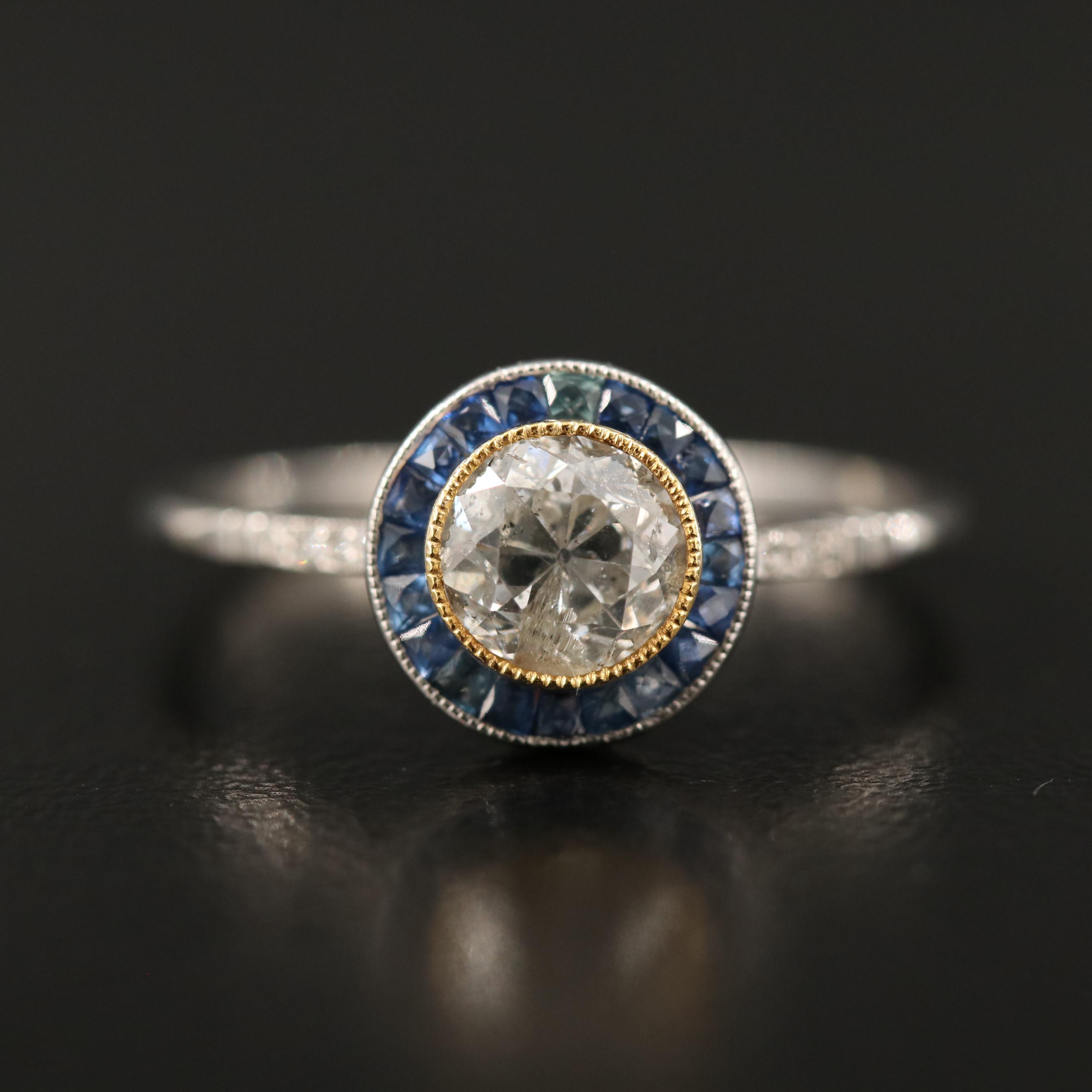 Vintage Platinum Diamond Ring with Sapphire Halo