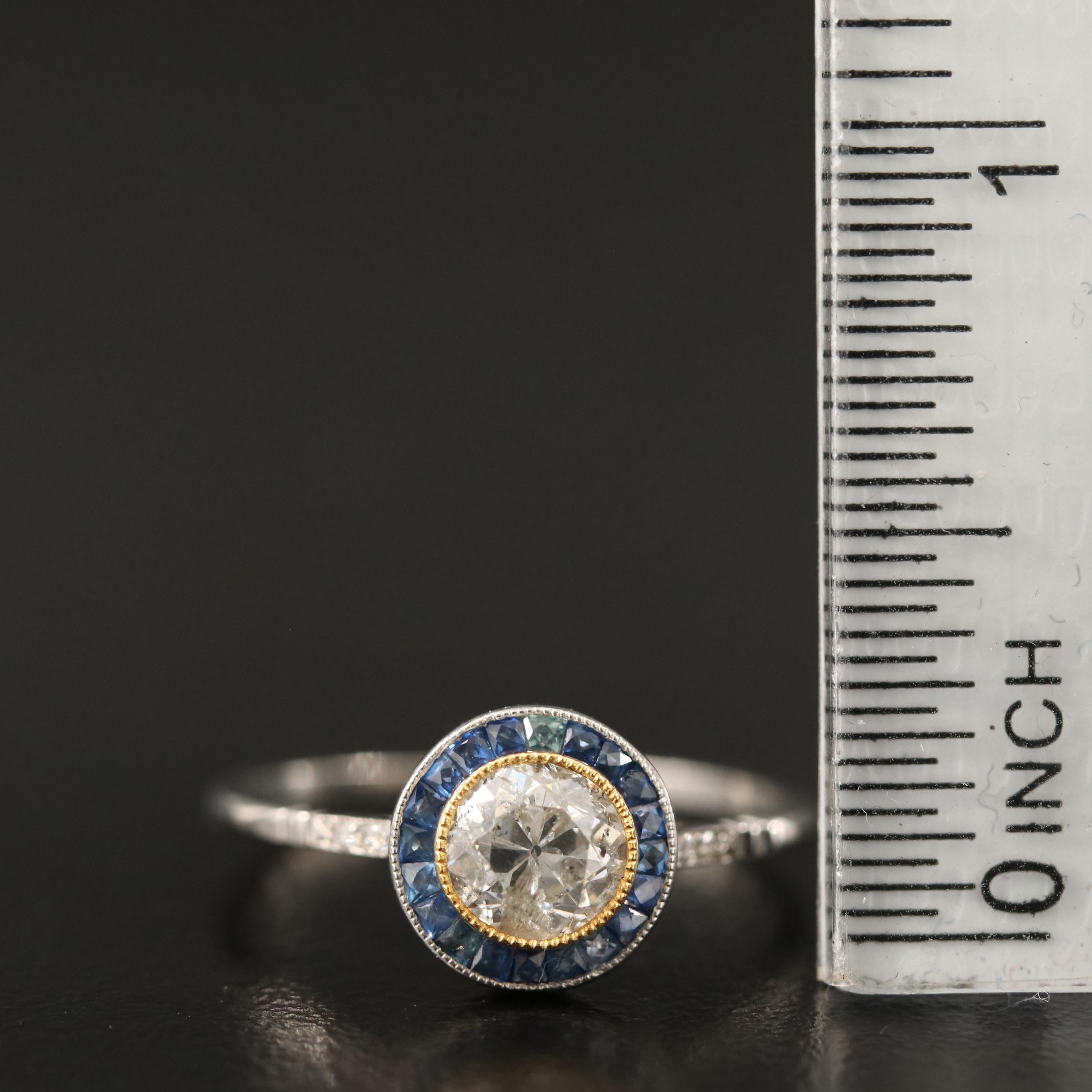 Vintage Platinum Diamond Ring with Sapphire Halo