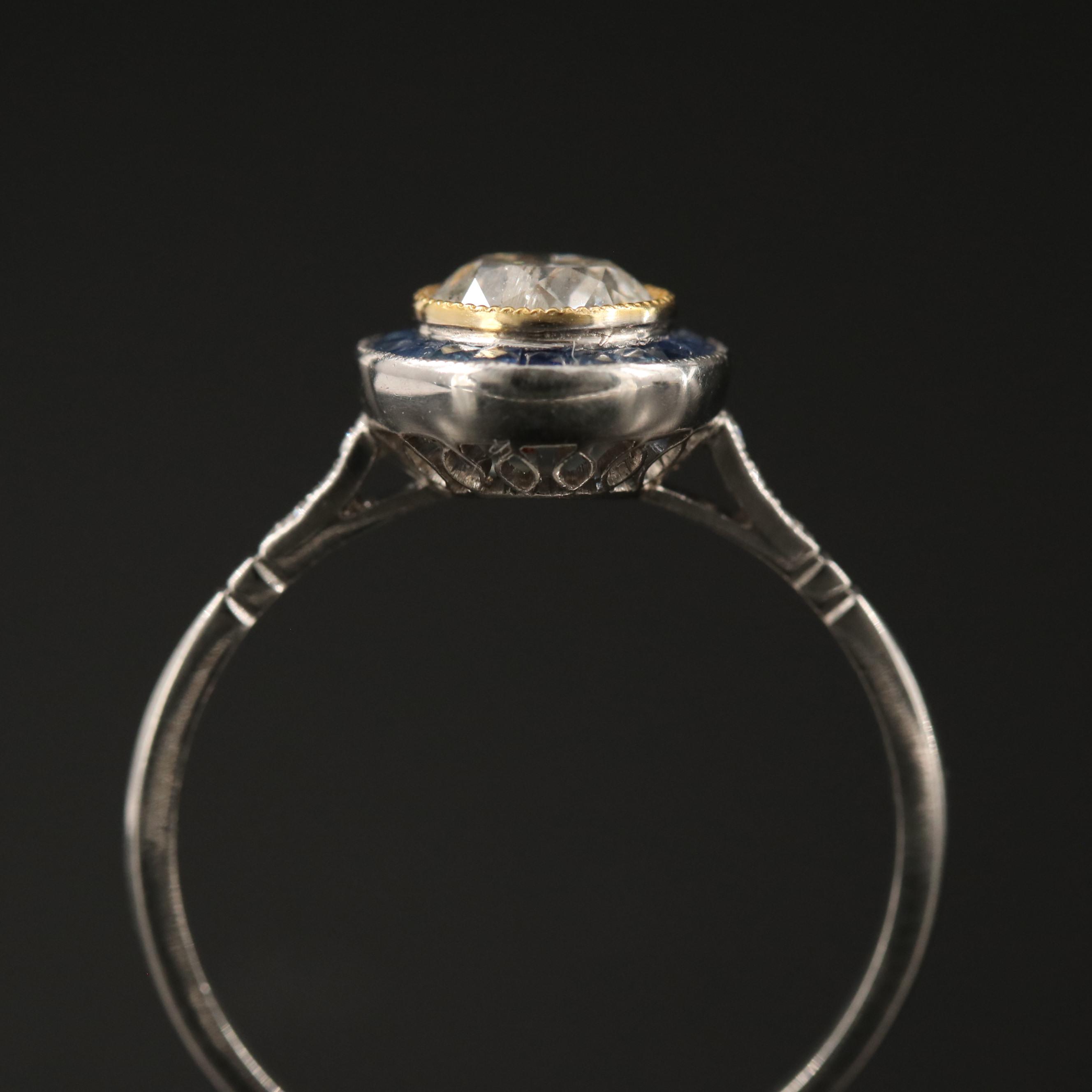 Vintage Platinum Diamond Ring with Sapphire Halo