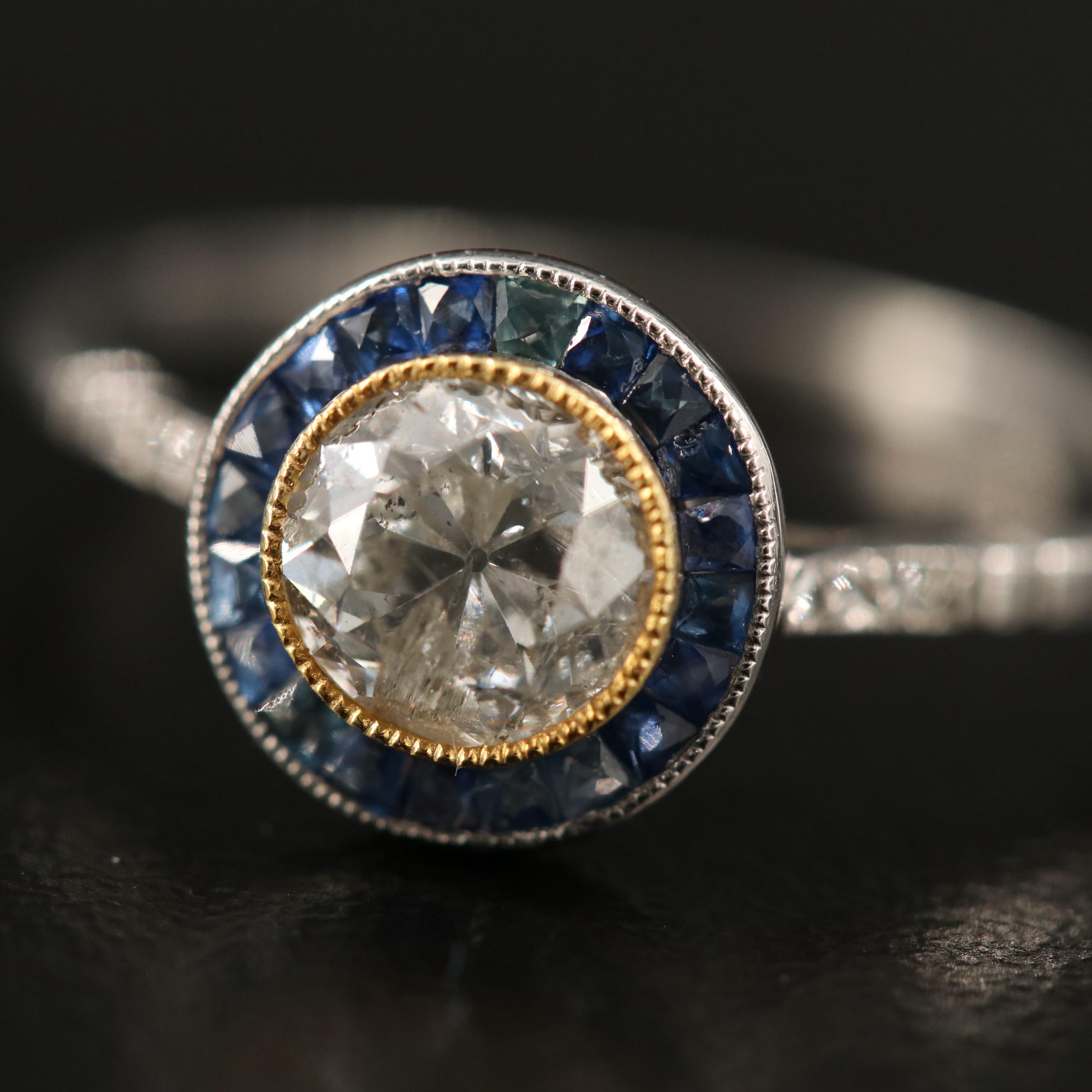Vintage Platinum Diamond Ring with Sapphire Halo