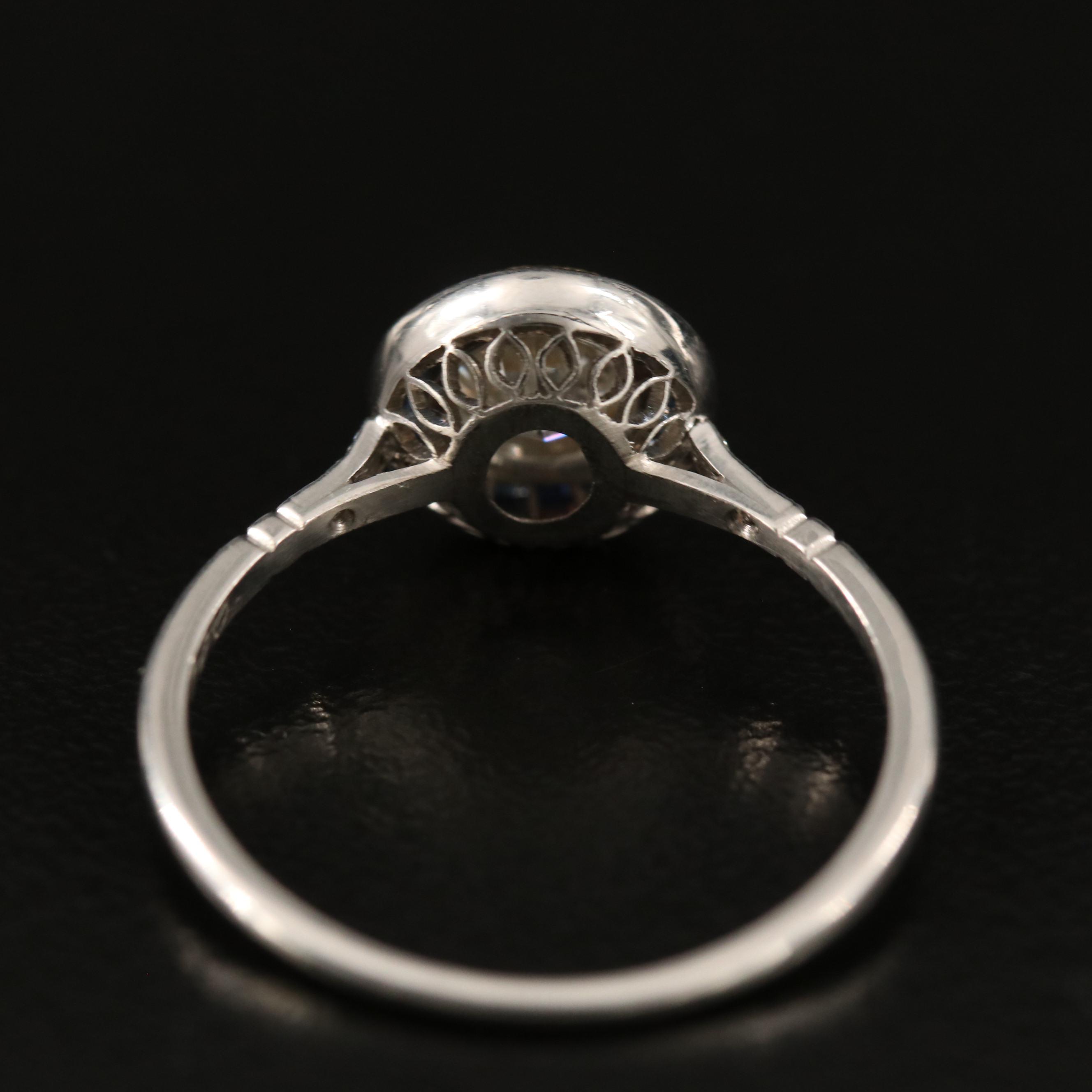 Vintage Platinum Diamond Ring with Sapphire Halo