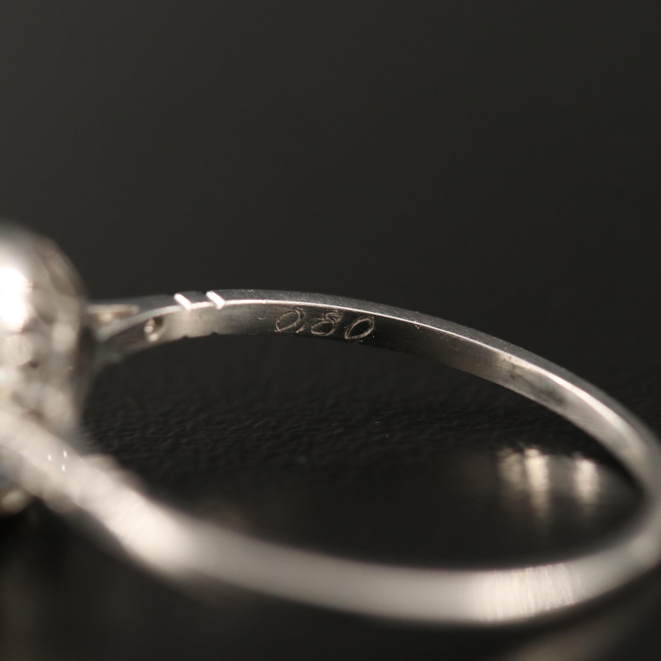 Vintage Platinum Diamond Ring with Sapphire Halo