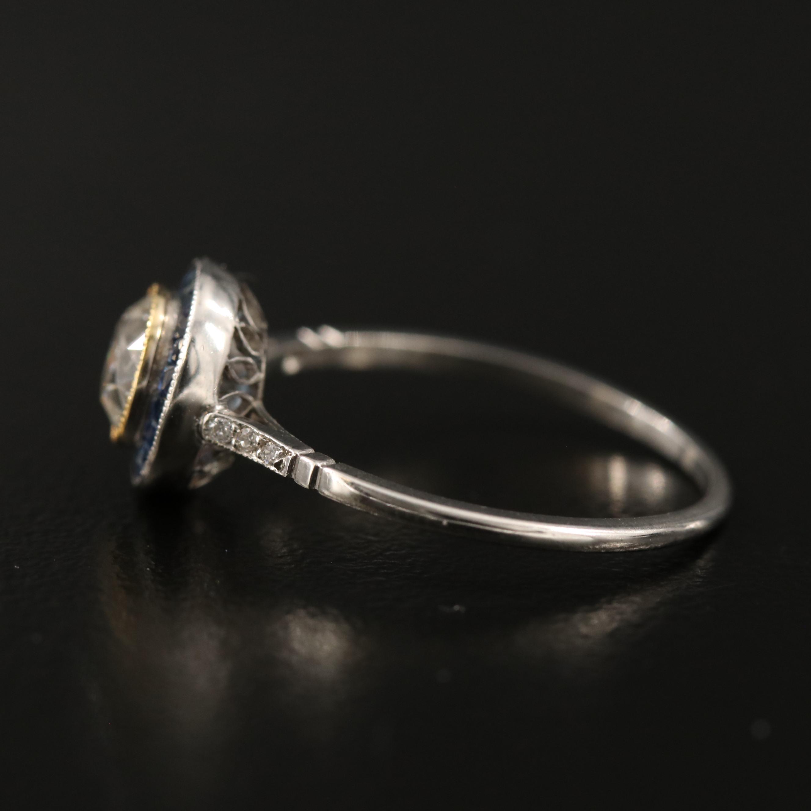 Vintage Platinum Diamond Ring with Sapphire Halo