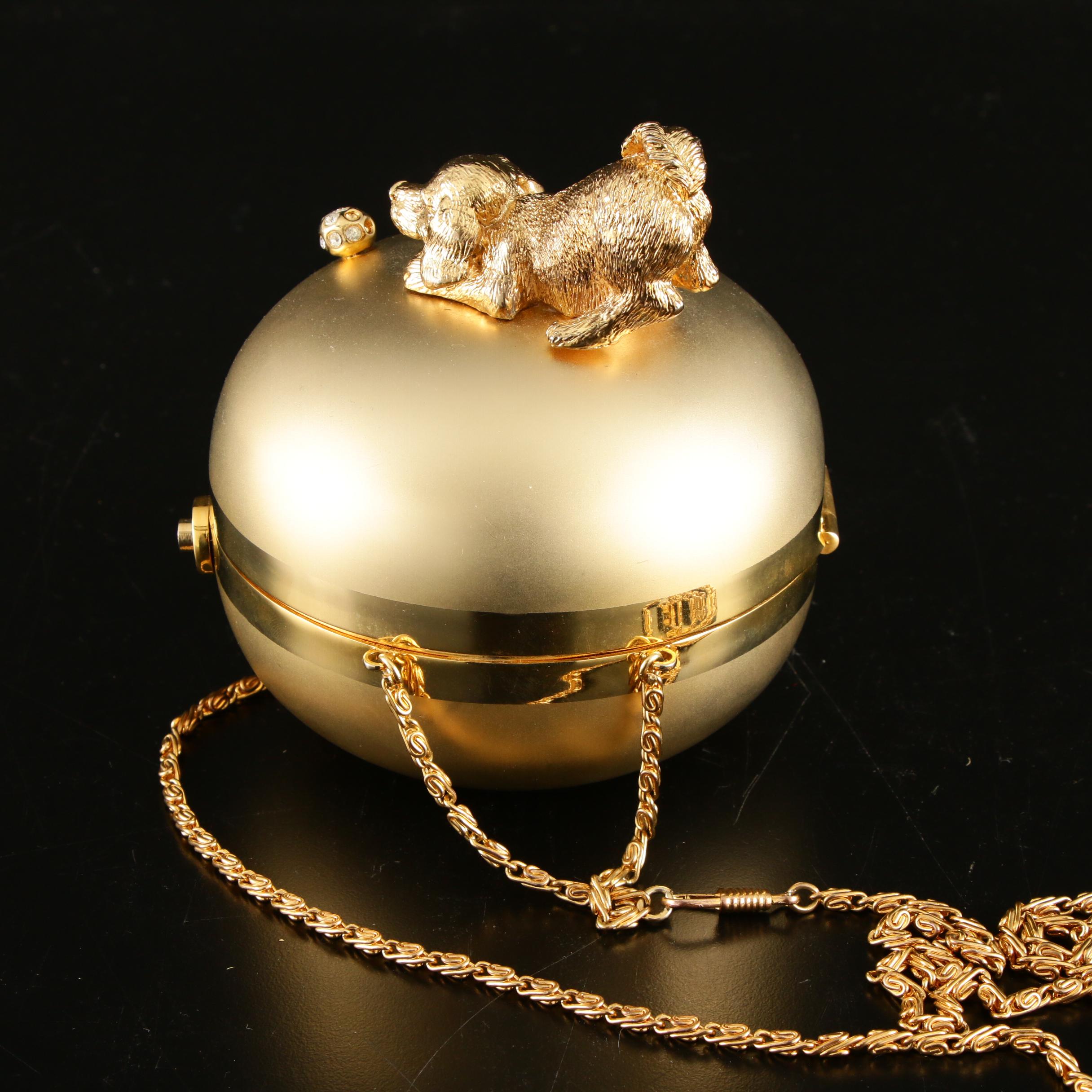 Sasha Evening Bag in Gold Tone Finish Depicting Dog Playing with Bejeweled Ball