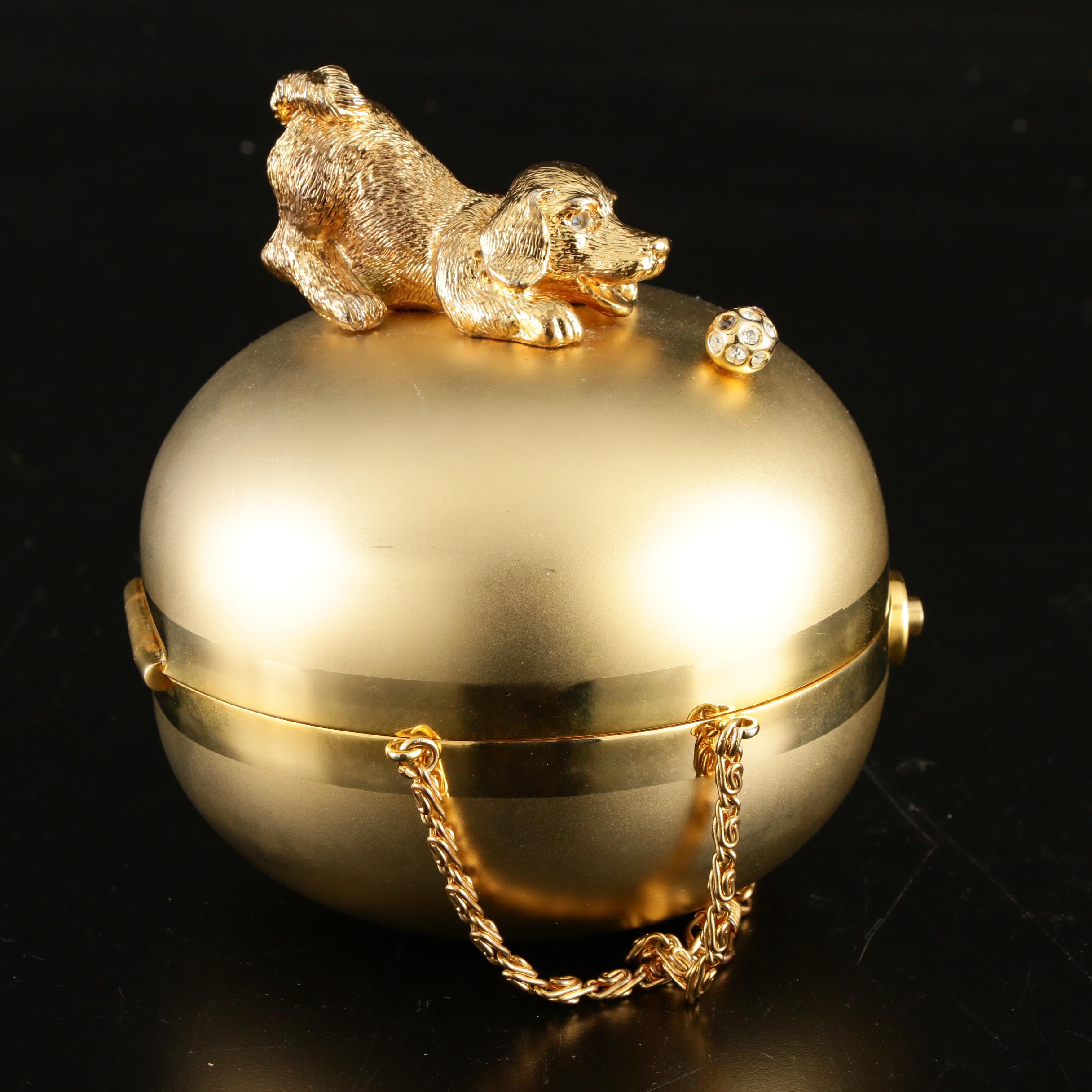 Sasha Evening Bag in Gold Tone Finish Depicting Dog Playing with Bejeweled Ball