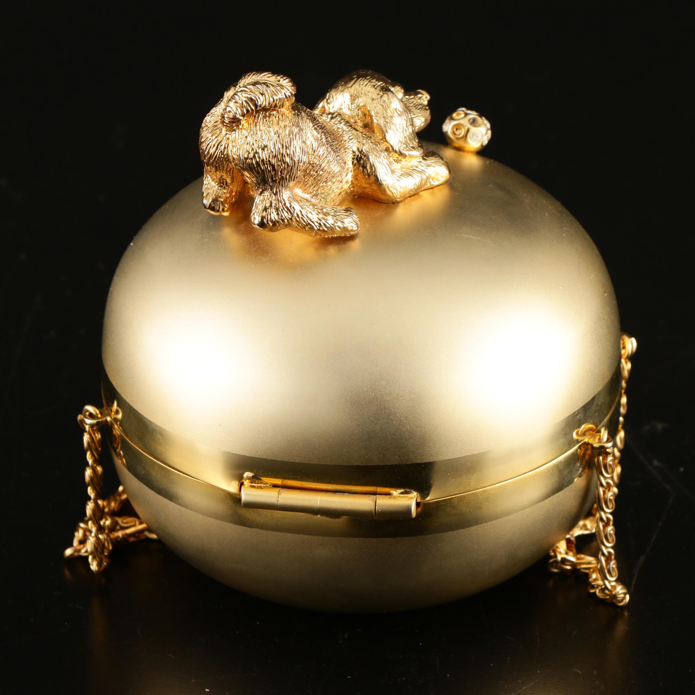 Sasha Evening Bag in Gold Tone Finish Depicting Dog Playing with Bejeweled Ball