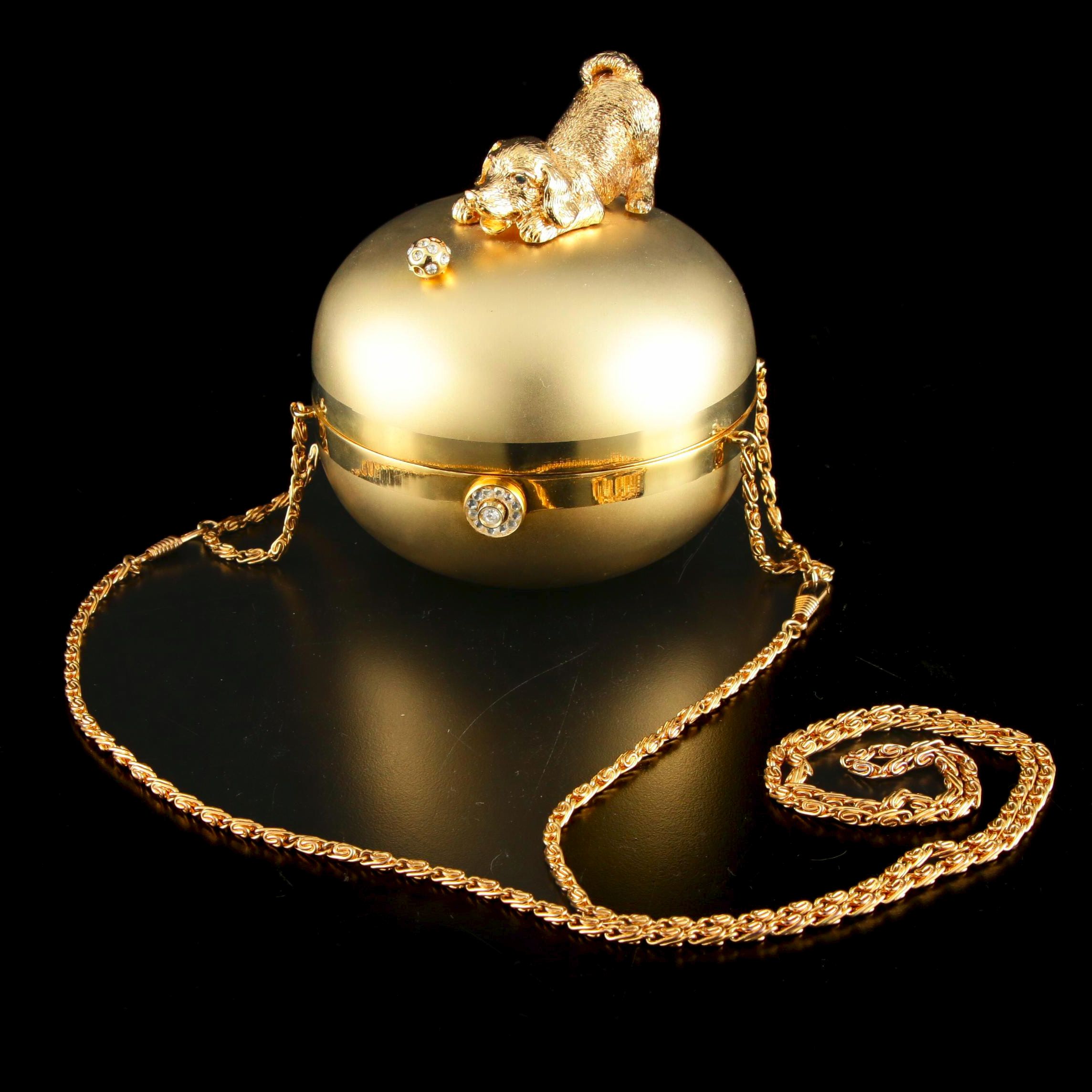 Sasha Evening Bag in Gold Tone Finish Depicting Dog Playing with Bejeweled Ball