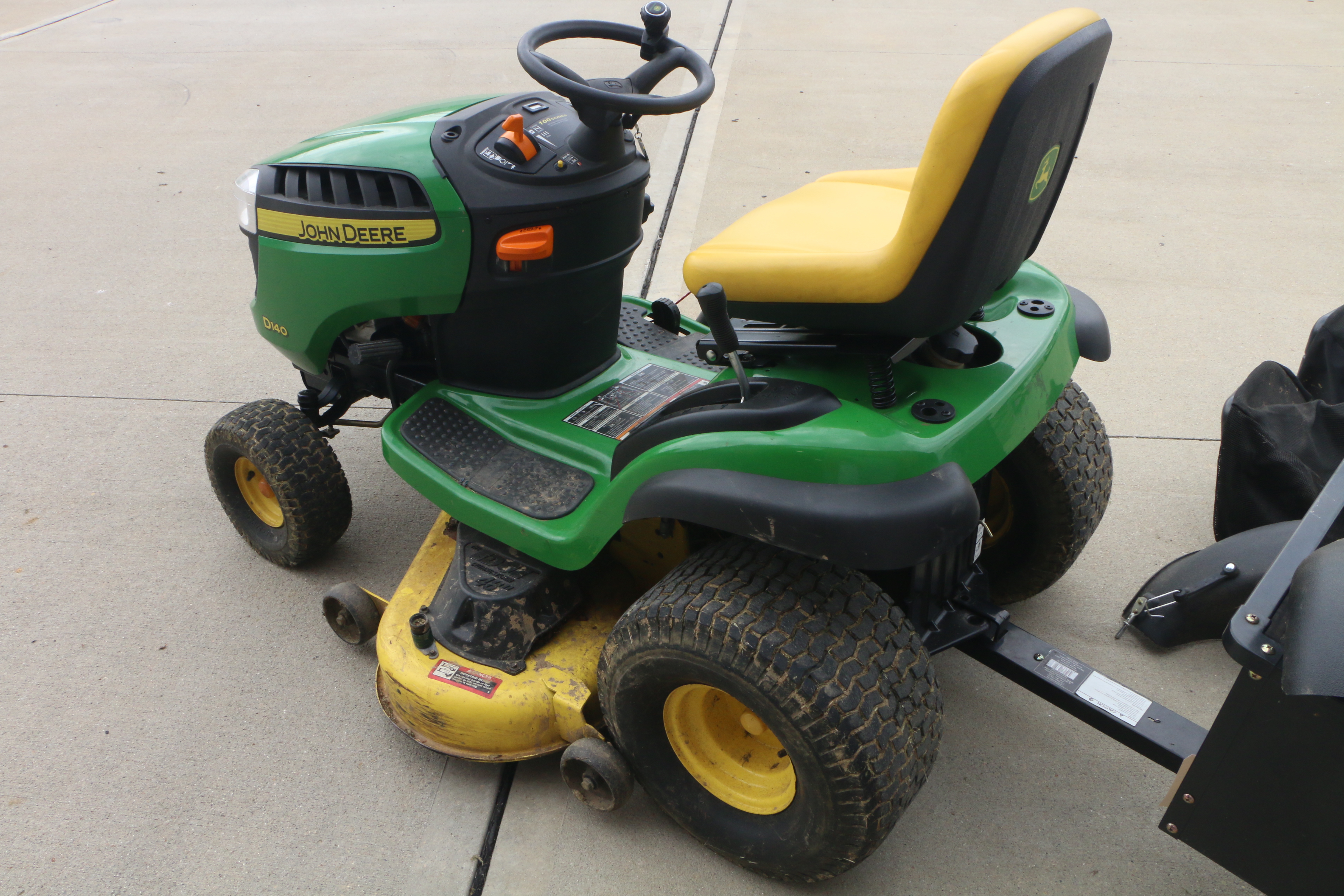 John Deere D140 Lawn Tractor with Tow Behind, Baggers and Side Vacuum Hose