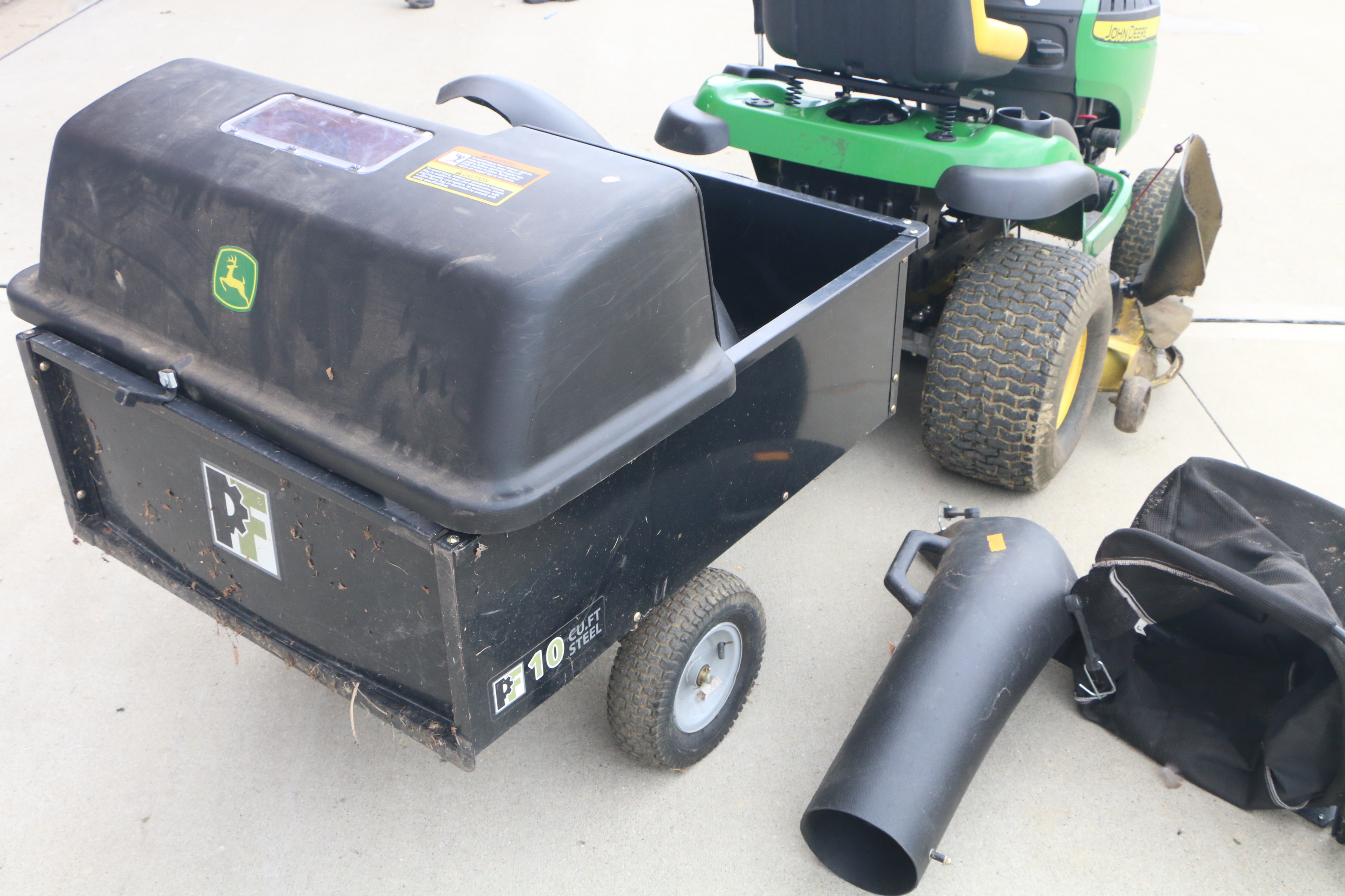 John Deere D140 Lawn Tractor with Tow Behind, Baggers and Side Vacuum Hose
