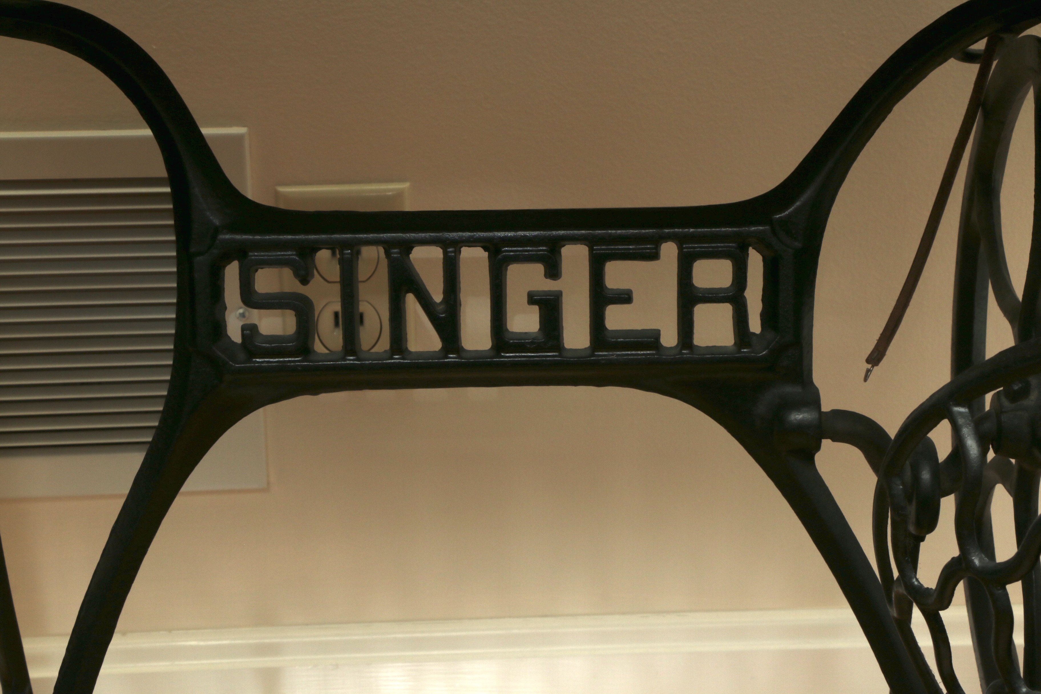 Singer Manufacturing Co. Sewing Machine in Oak Cabinet, Iron Treadle Base, 1919