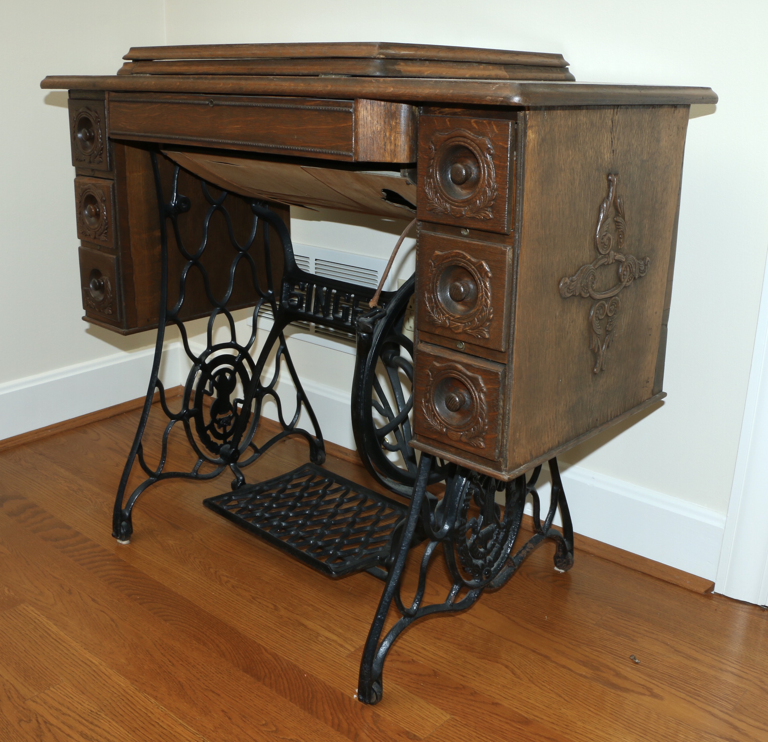 Singer Manufacturing Co. Sewing Machine in Oak Cabinet, Iron Treadle Base, 1919