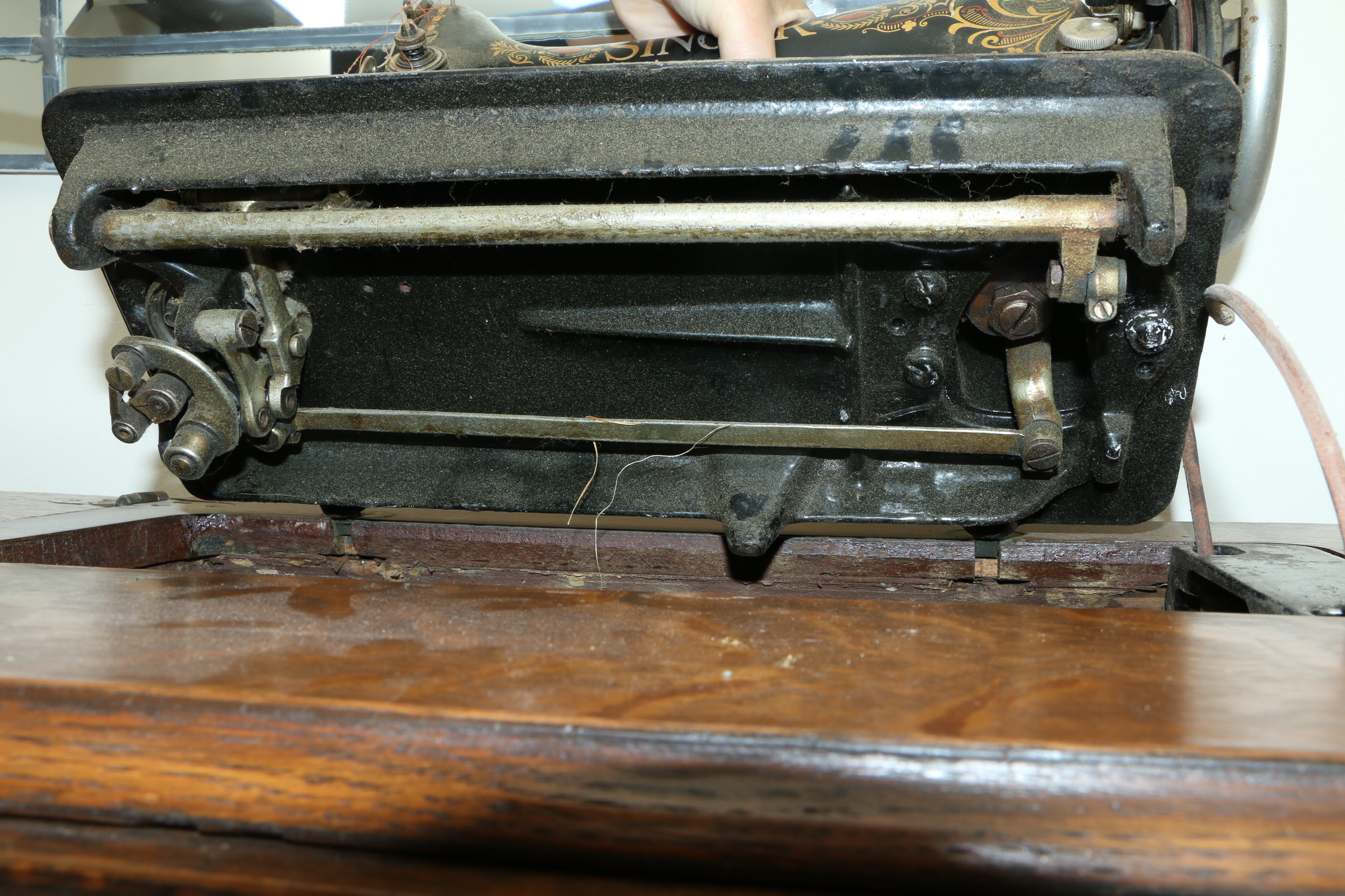Singer Manufacturing Co. Sewing Machine in Oak Cabinet, Iron Treadle Base, 1919