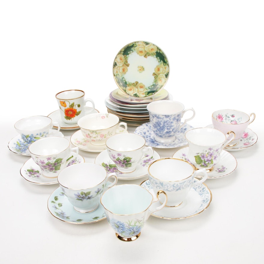 Hand-Painted Display Plates and Teacup Assortment