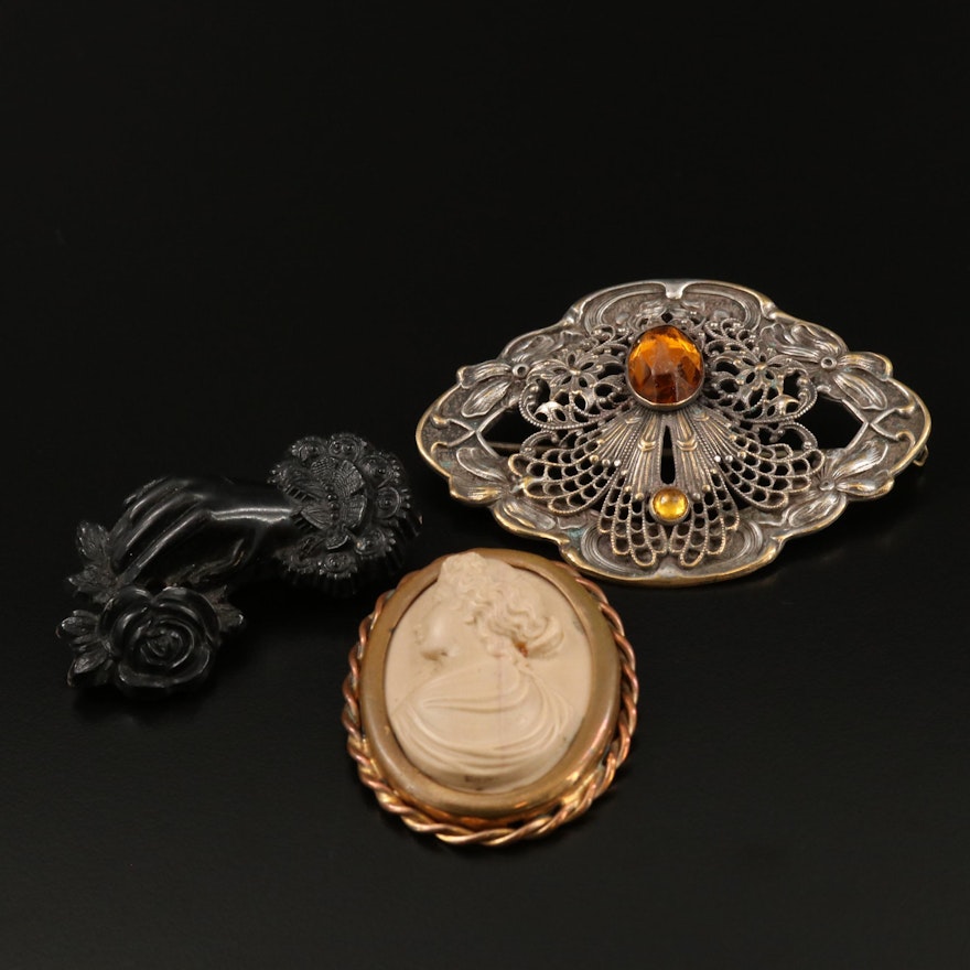 Collection of Antique Brooches Featuring Carve Black Coral and Lava Cameo