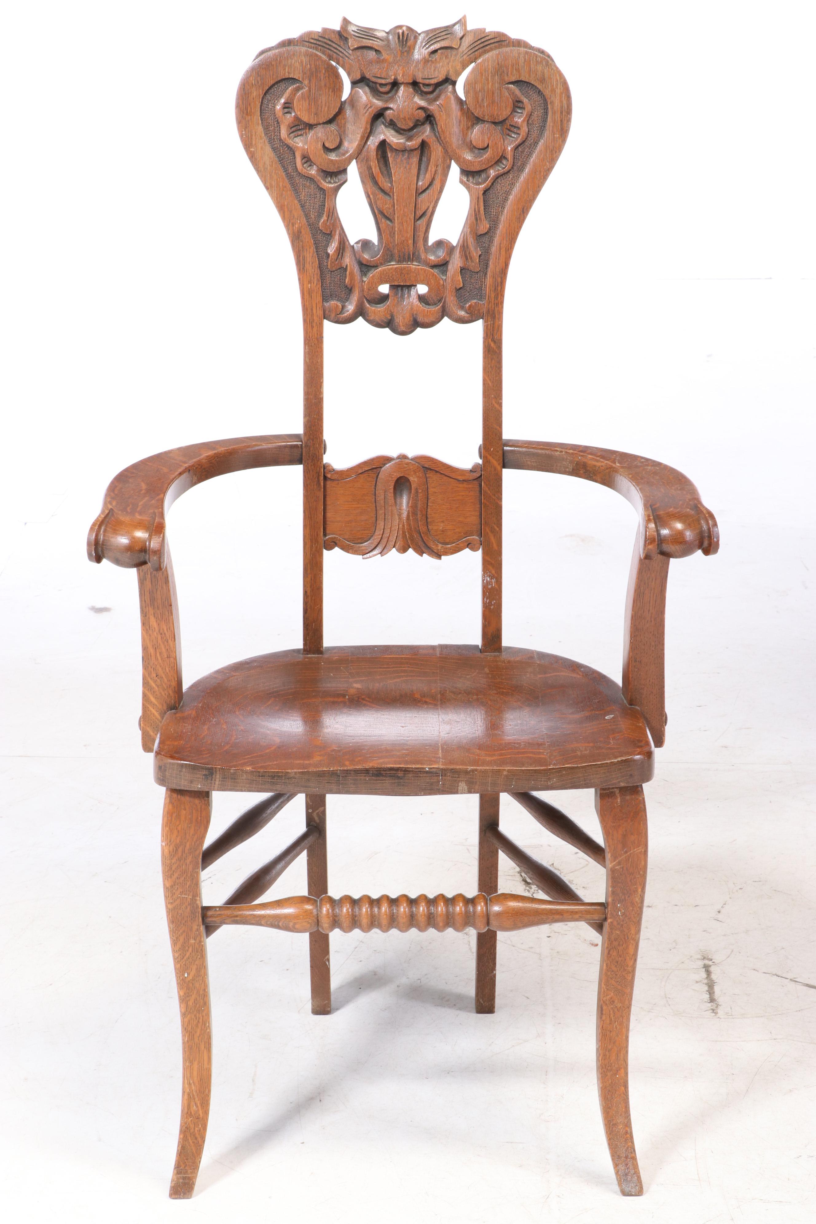 Two American Carved Oak "North Wind" Chairs, circa 1900