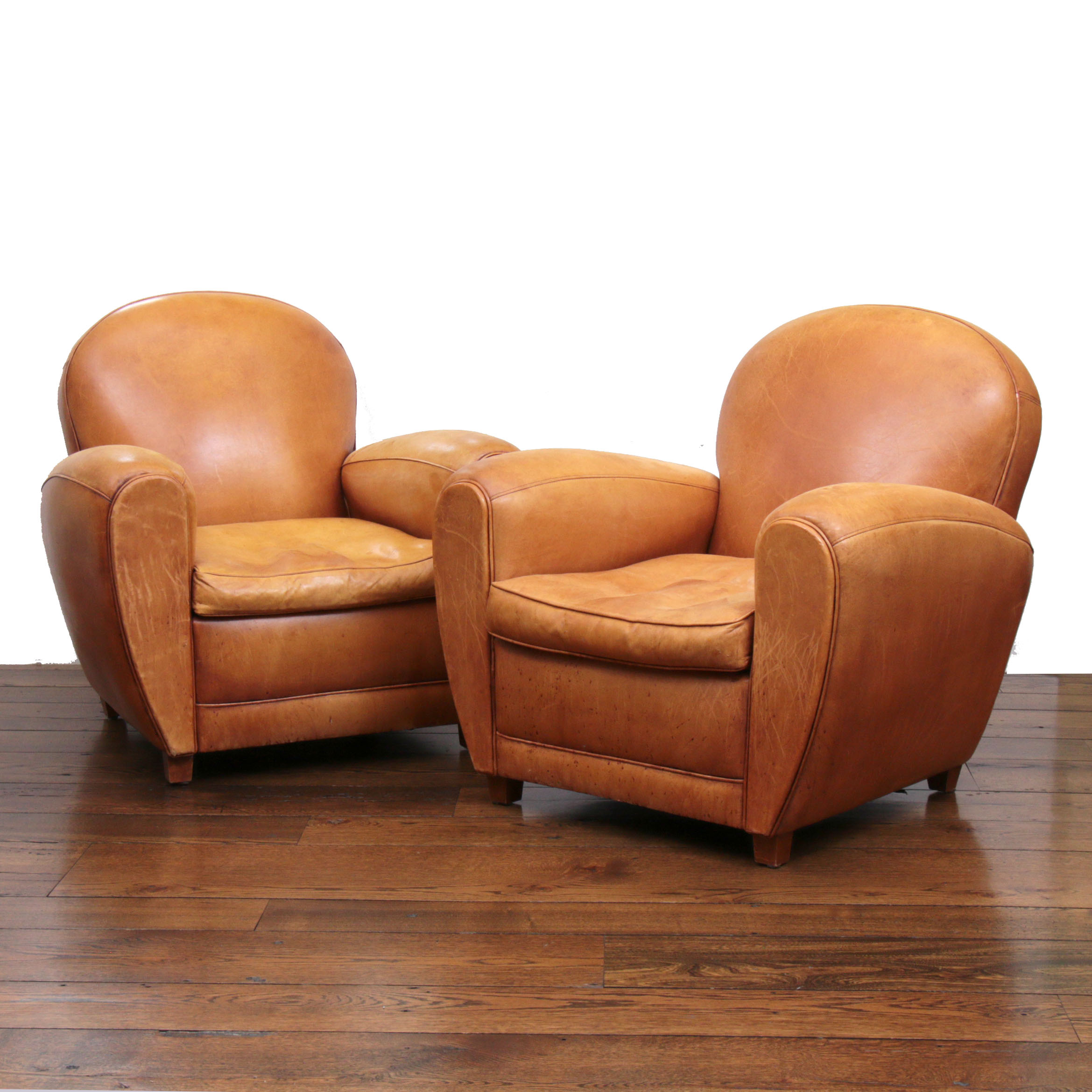 Distressed Leather Armchairs with Nailhead Trim by Centners Design