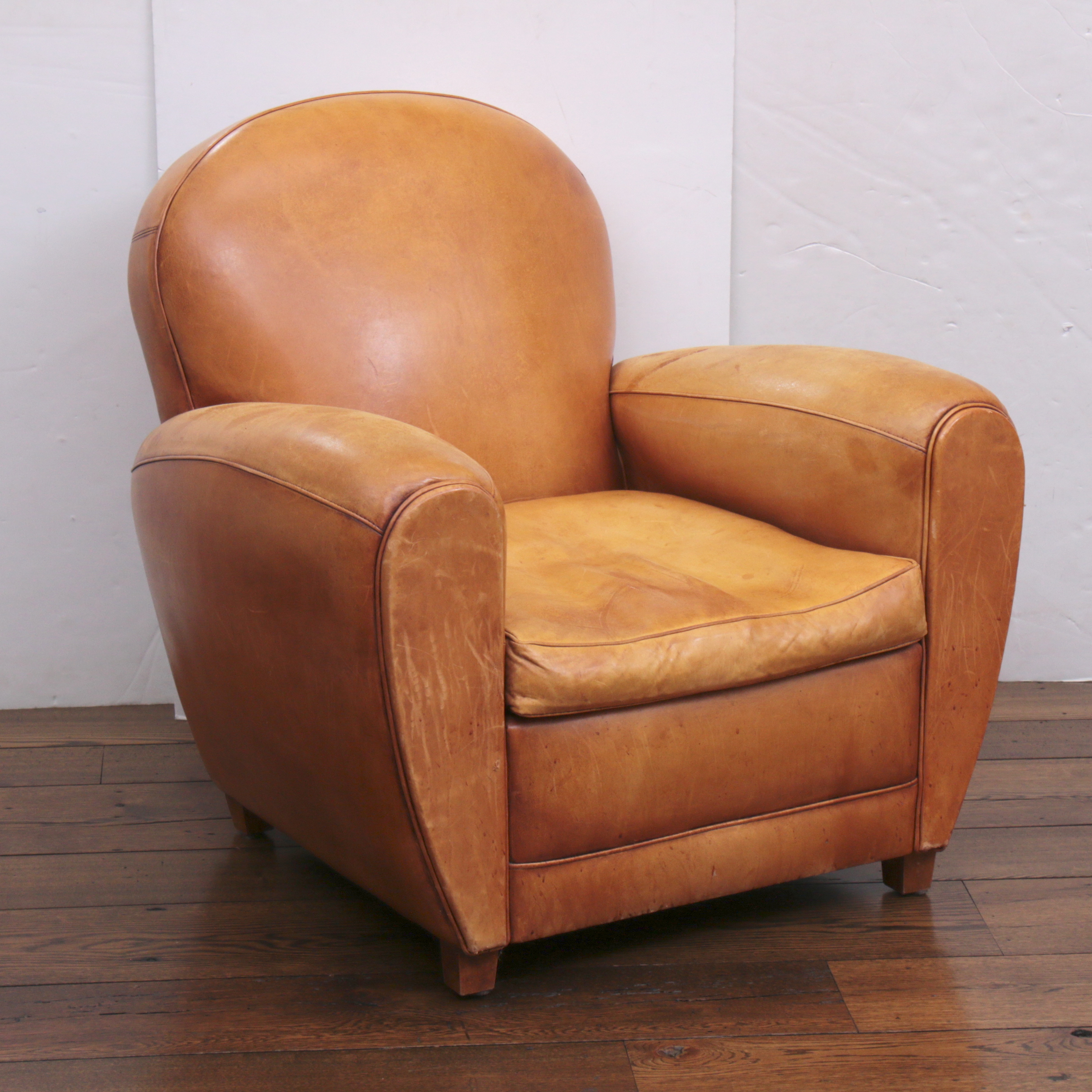 Distressed Leather Armchairs with Nailhead Trim by Centners Design