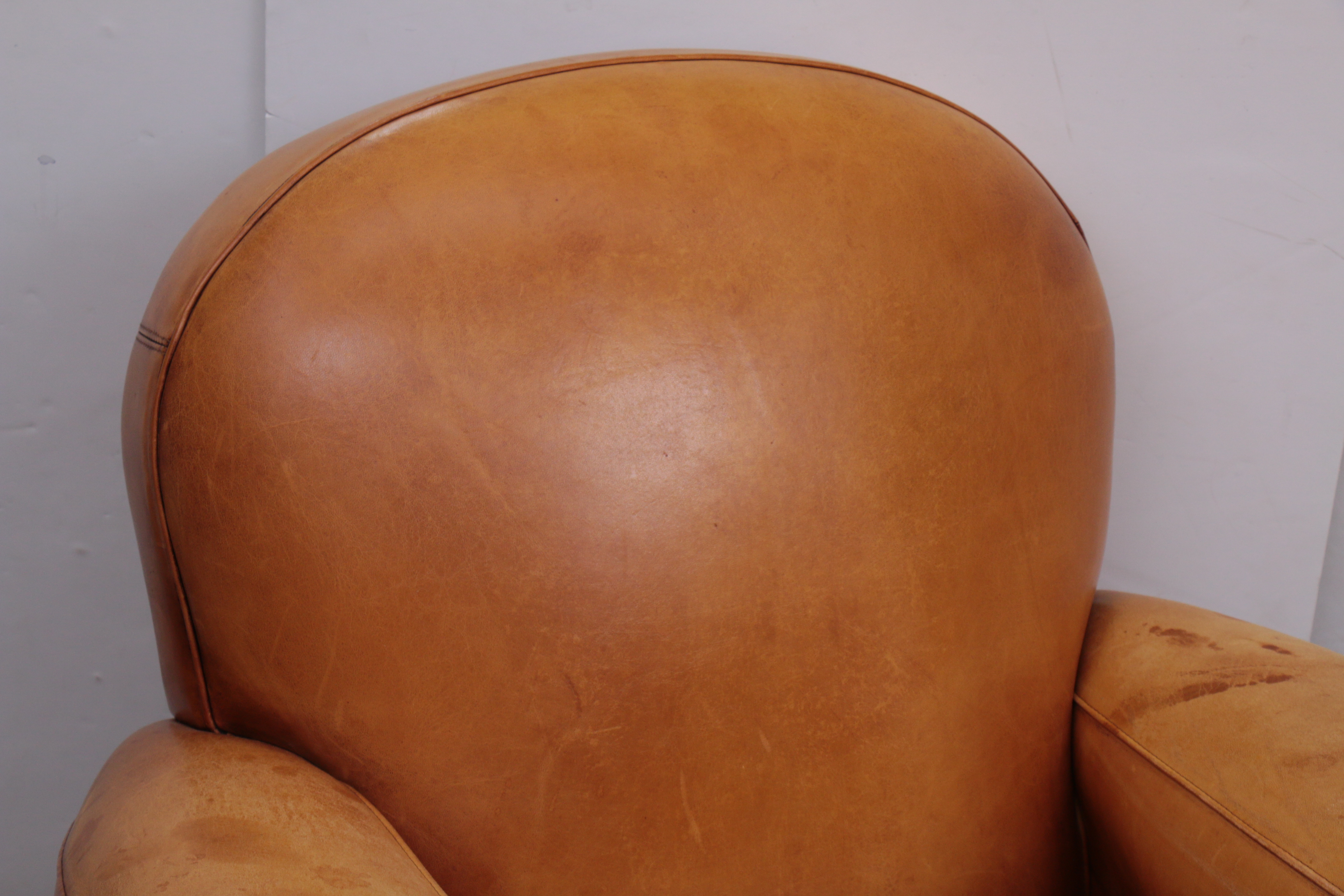 Distressed Leather Armchairs with Nailhead Trim by Centners Design
